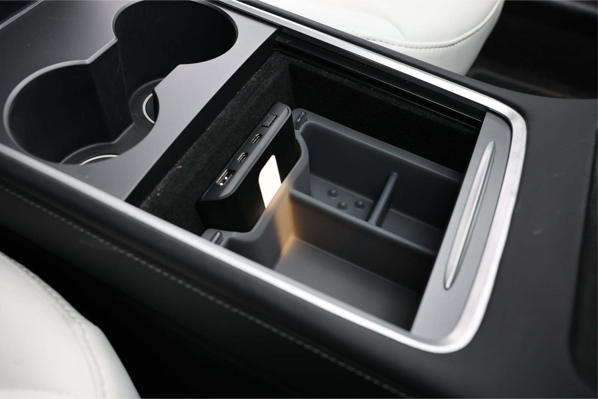 center console organizer with transparent design and USB hub in tesla car