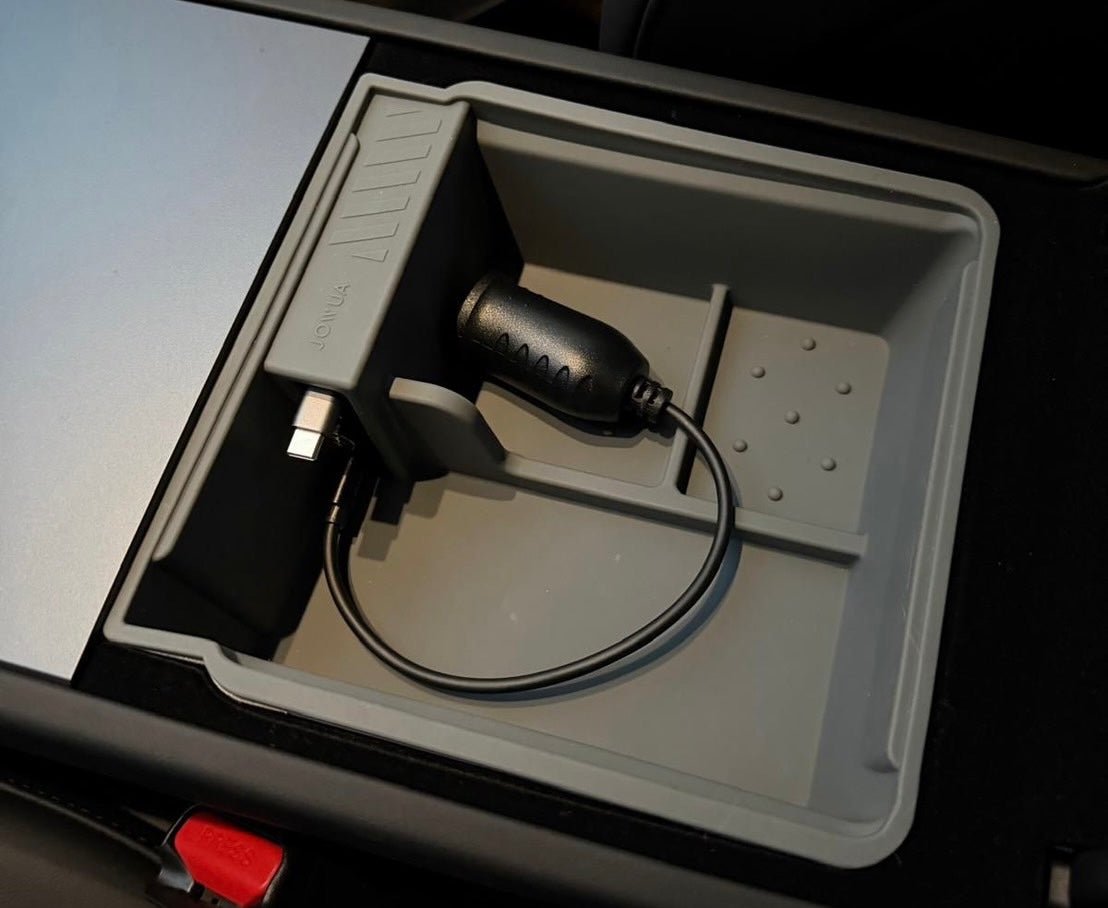 The JOWUA Center Console Organizer Set with Power HUB for Tesla Model 3 Standard 2026+ in black and gray holds wired devices, features a small display port with power adapter, and offers multiple compartments for storage.