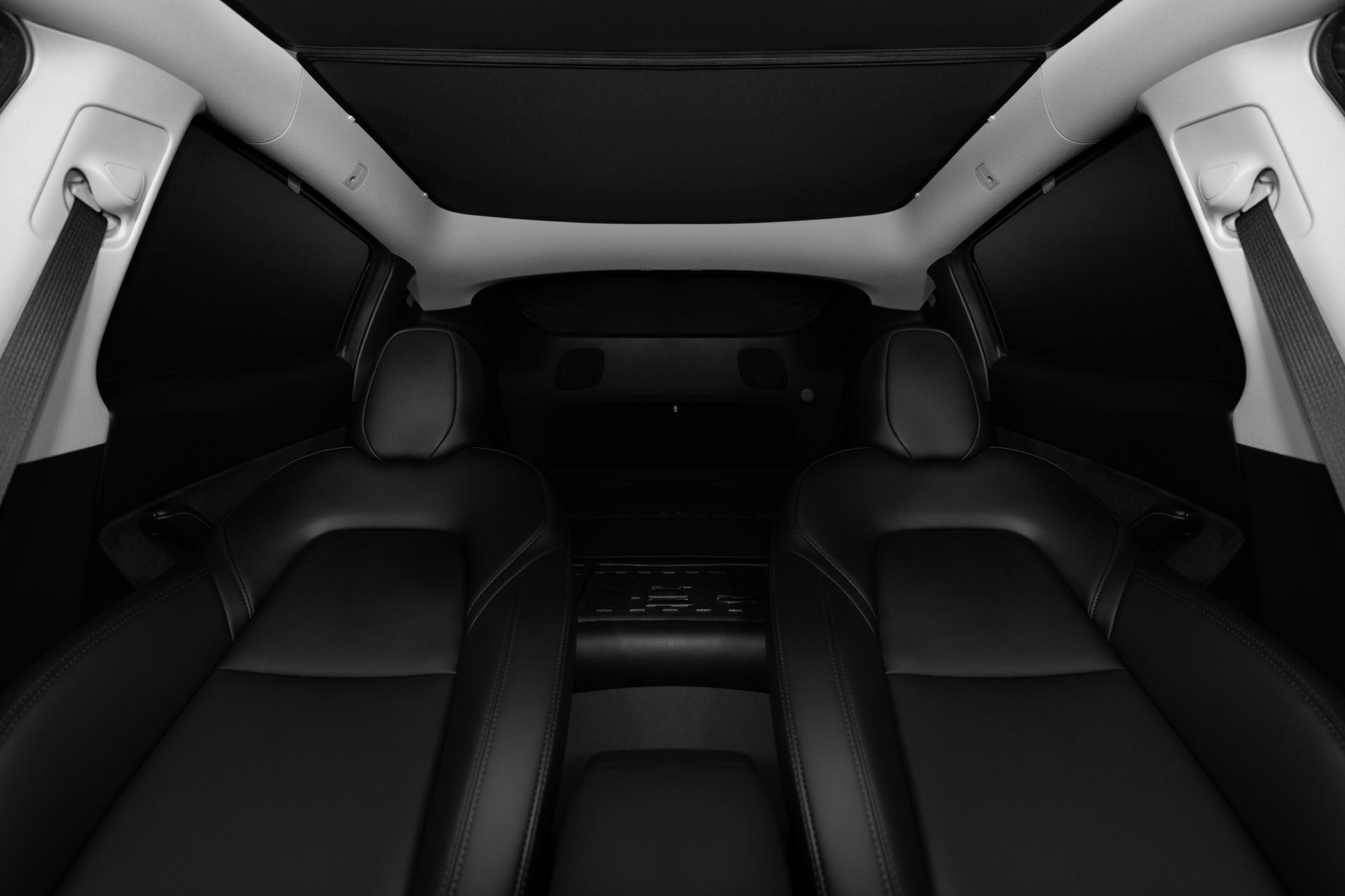 The interior view of the car features two sleek, black leather front seats with a centered armrest. The headrests emerge beneath a JOWUA Model Y Ultimate Sunshade Bundle, and the ceiling's black finish enhances the modern luxury while offering UV protection.