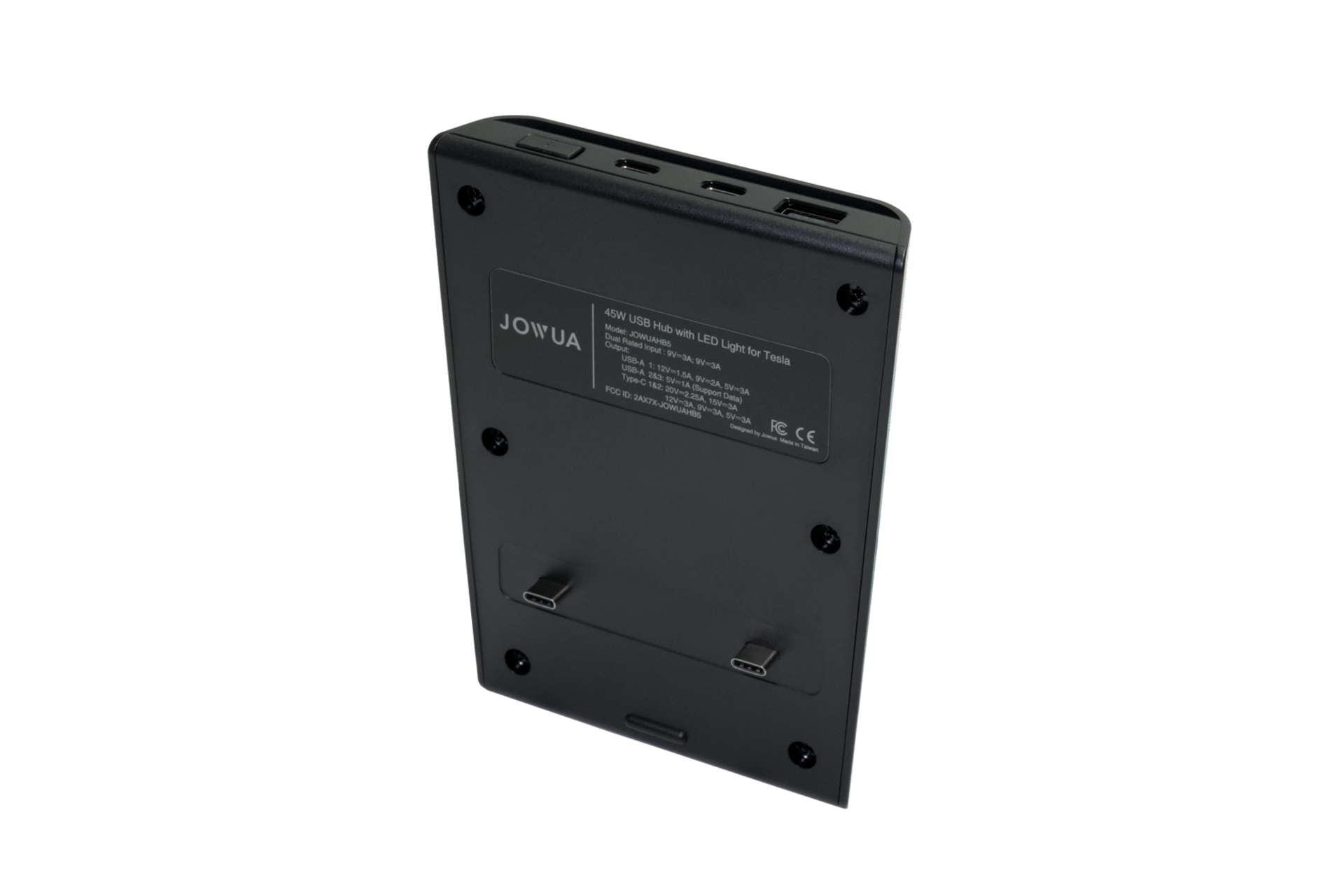 The image showcases a black electronic device labeled "JOWUA," specifically designed as a center console accessory for the Tesla Model 3/Y. It includes specifications of Dual USB-C 45W and features like LED warm light, along with a detachable kickstand and three ports on its top edge, serving as a versatile USB hub.