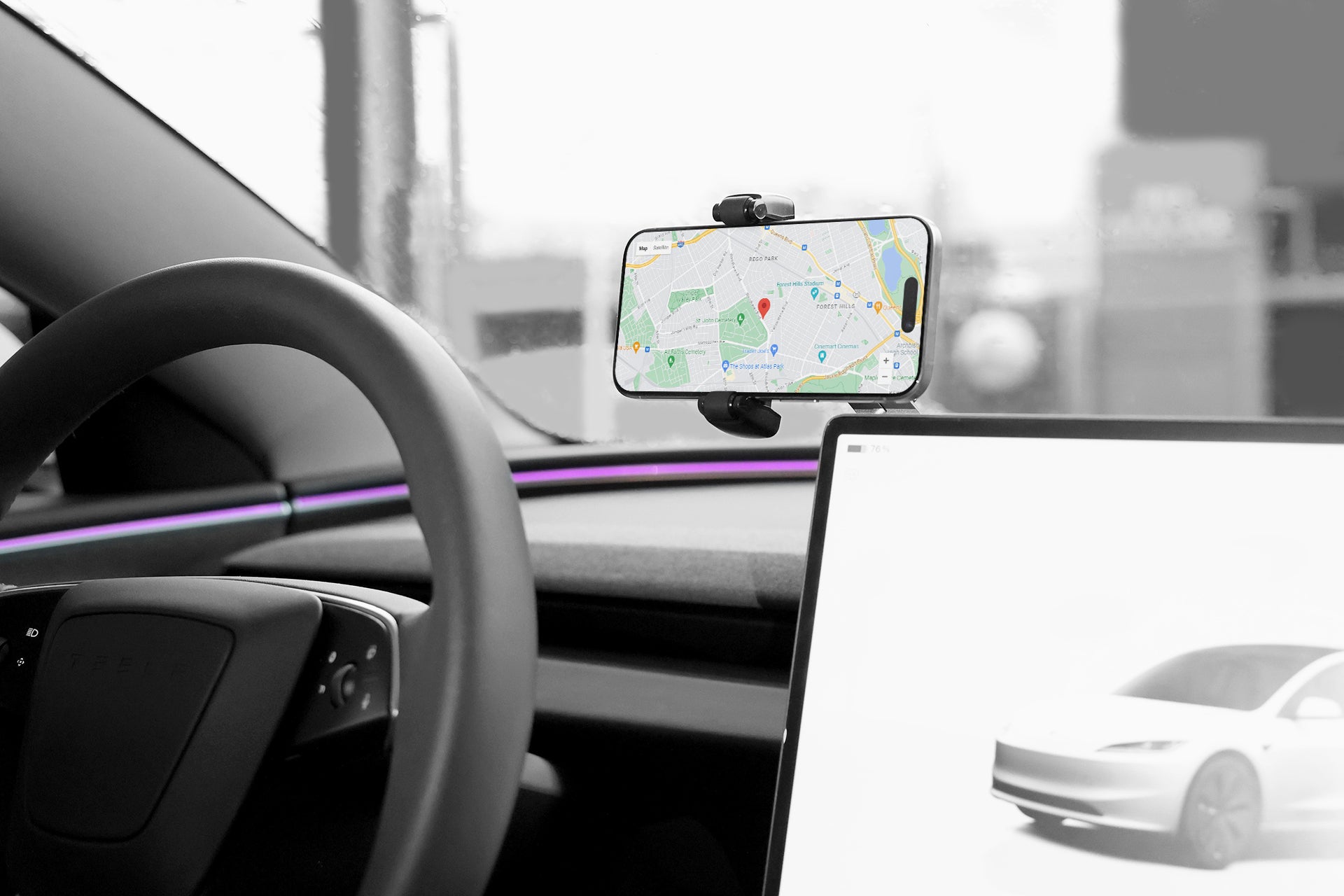 The car's interior features a cutting-edge design with the JOWUA 6D Invisible Foldaway Car Mount (Universal) on the dashboard for adjustable smartphone positioning, displaying a GPS map. The steering wheel is on the left, and a durable material encases a large screen showing a car image on the right.