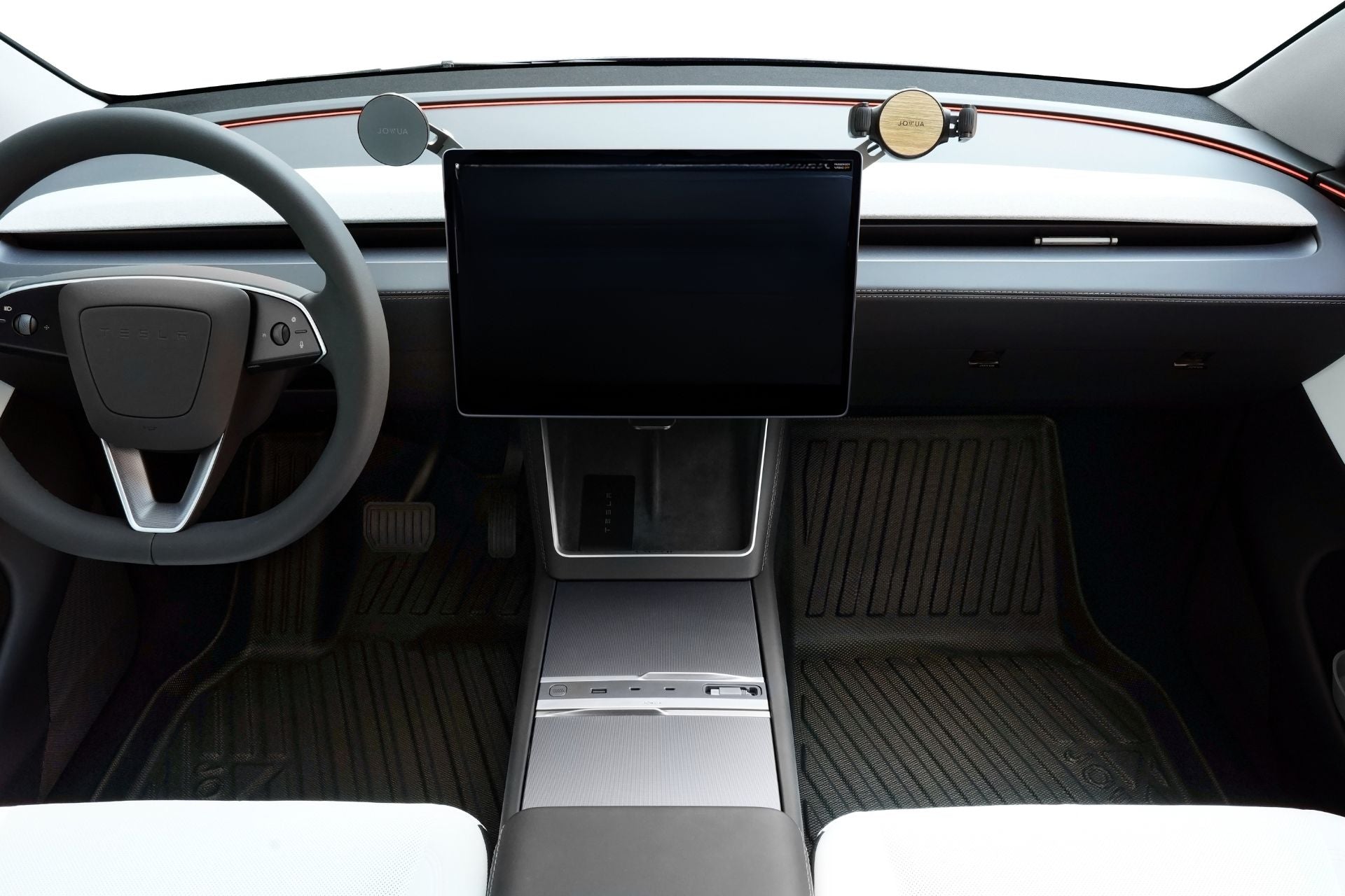 Interior view of a Tesla Model Y with minimalist dashboard, large central touchscreen, two circular windshield mounts, steering wheel, and JOWUA Model Y (Juniper 2025+) All-Weather Floor Liners Combo.