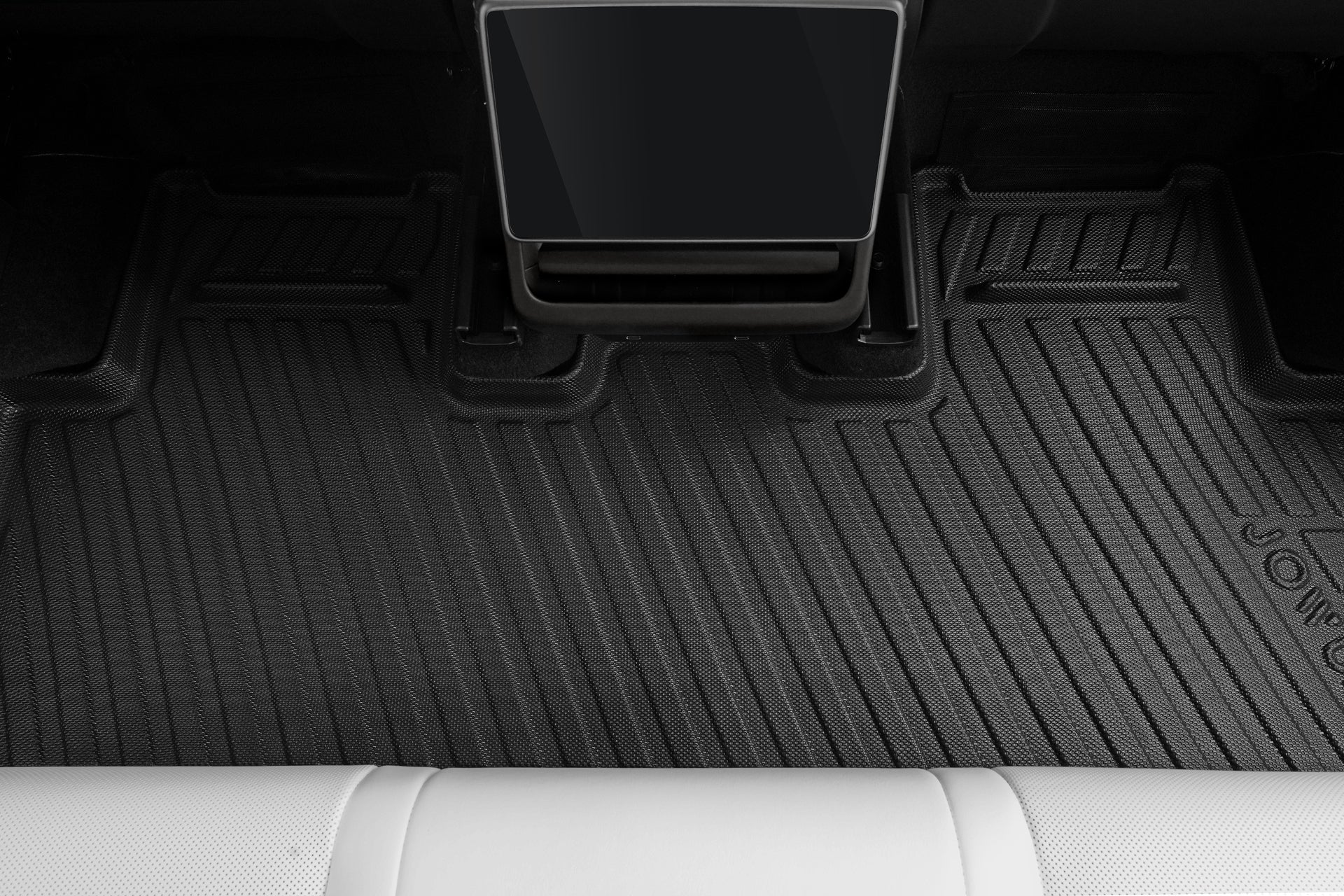A close-up of JOWUA Model Y (Juniper 2025+) All-Weather Floor Liners Combo in the rear seat area with white leather seats, touchscreen display, and a Jowua Tissue Box Holder for added convenience.