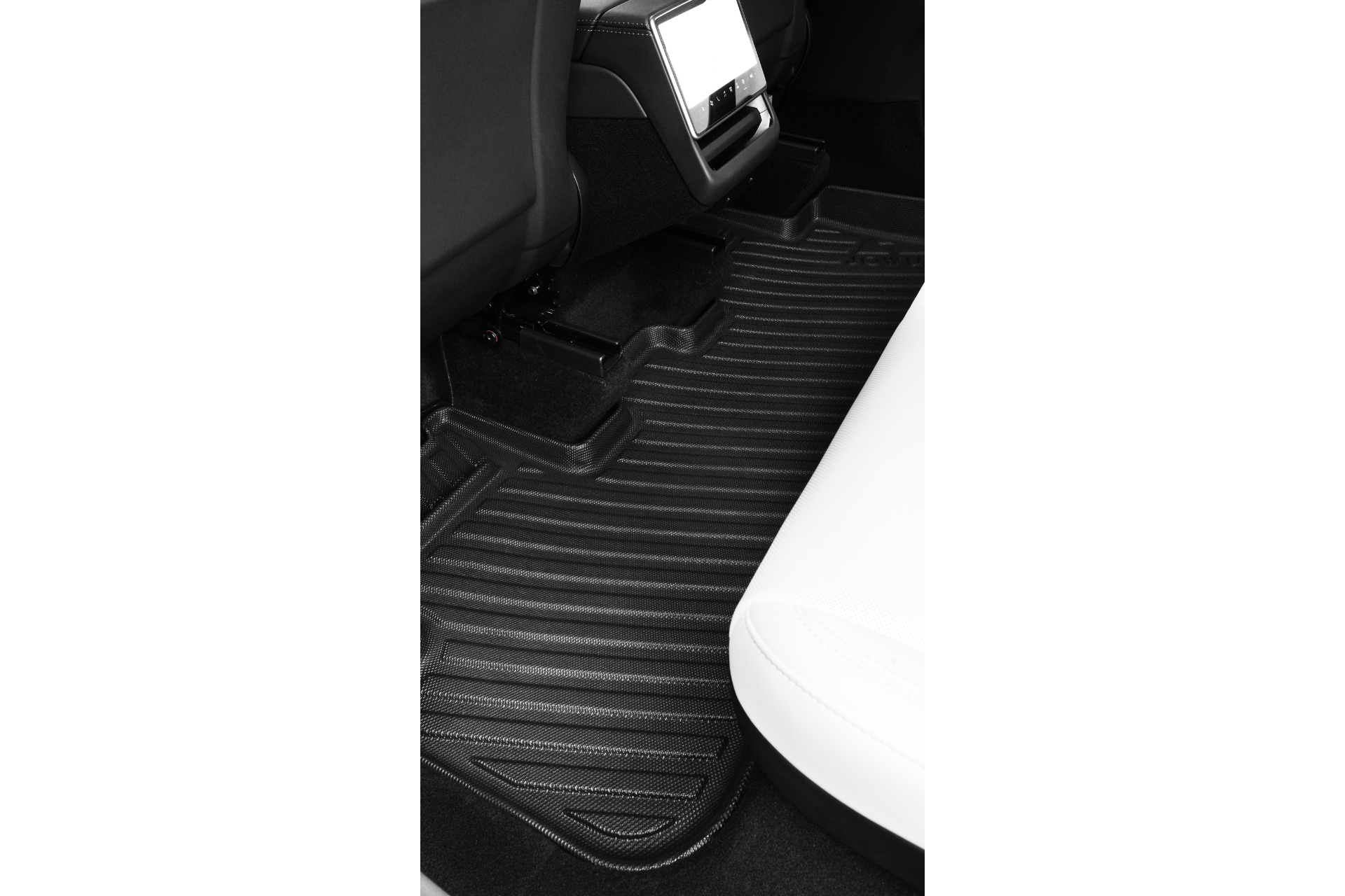 A close-up of a Tesla Model Y (Juniper 2025+) rear interior shows JOWUA’s custom-fit black All-Weather Floor Liners Combo with raised edges, placed between the black front seat and white back seat.