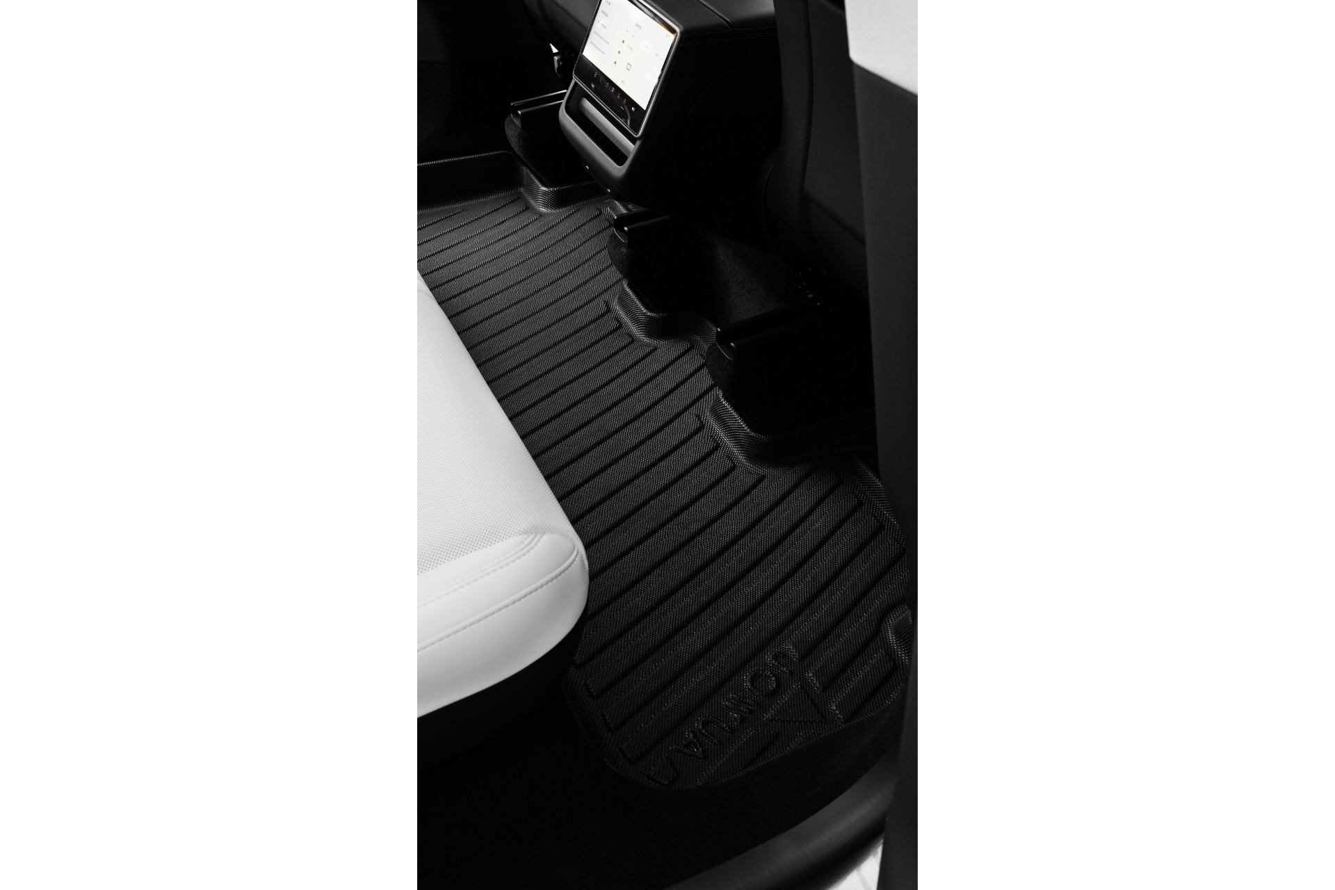 Black, contoured JOWUA Model Y (Juniper 2025+) All-Weather Floor Liners Combo with raised grooves are placed in the rear footwell of a Tesla Model Y with white seats, center console, screen, and “MODEL Y” label on the mat.