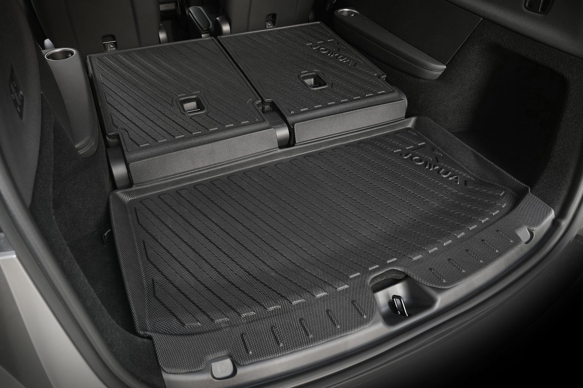 Close-up of a Model Y L (2026+) trunk with JOWUA’s Interior/Trunk Full Coverage Liner Combo protecting the flat, extended cargo space created by folding down the rear seats.