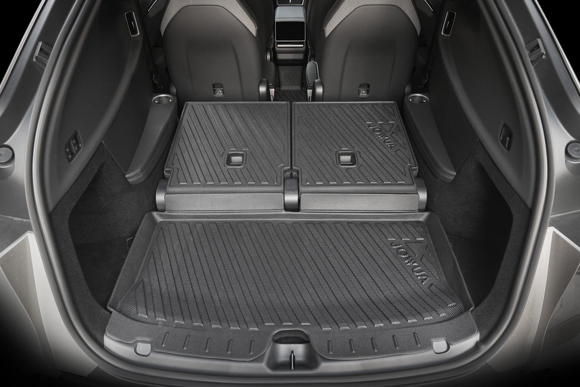 The JOWUA Model Y L (2026+) Interior / Trunk Full Coverage Liner Combo protects the clean, spacious cargo area with rear seats folded, showcasing durable black and gray waterproof protection for expanded storage.