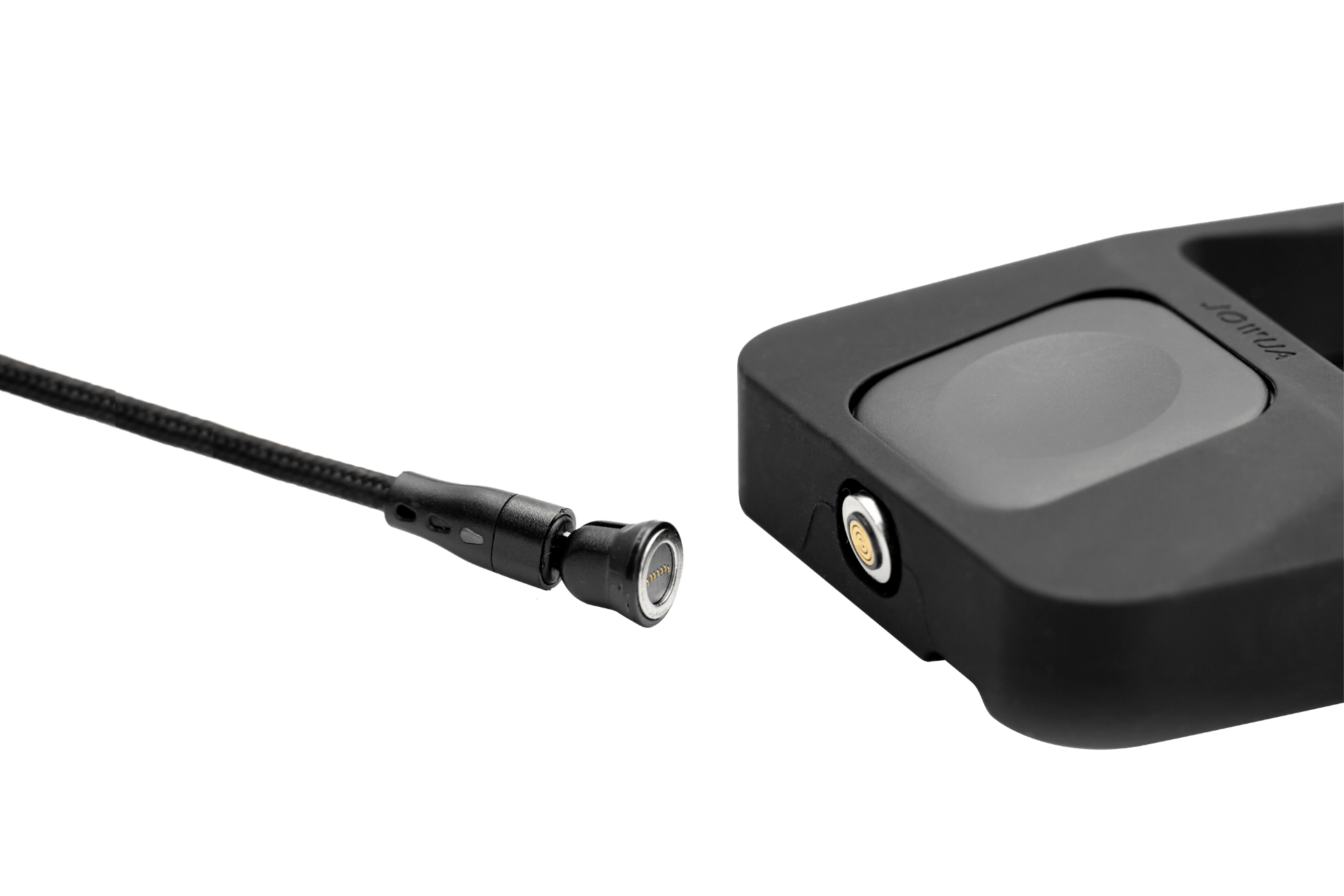 A close-up of JOWUA’s Power Dock Combo, an Apple accessory charger for Tesla, highlights its black magnetic connector and matching charging port in a sleek, Tesla-like design against a white background.