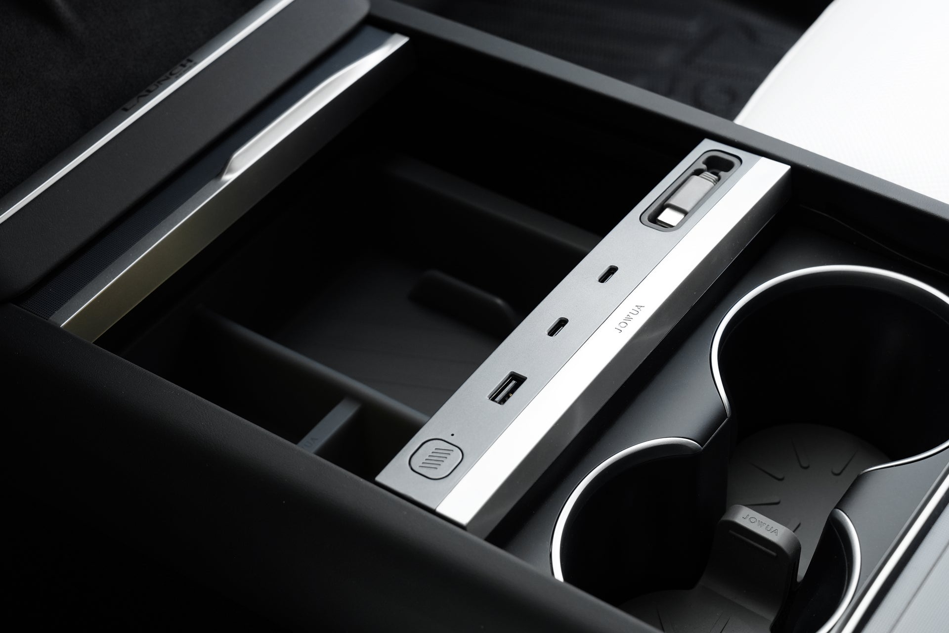 Close-up of the JOWUA LED Center Console Combo for Tesla Model Y Juniper (2025+), featuring cup holders, metallic-finish organizer with USB ports, item slot, and premium non-toxic silicone accents in a modern eco-friendly design.