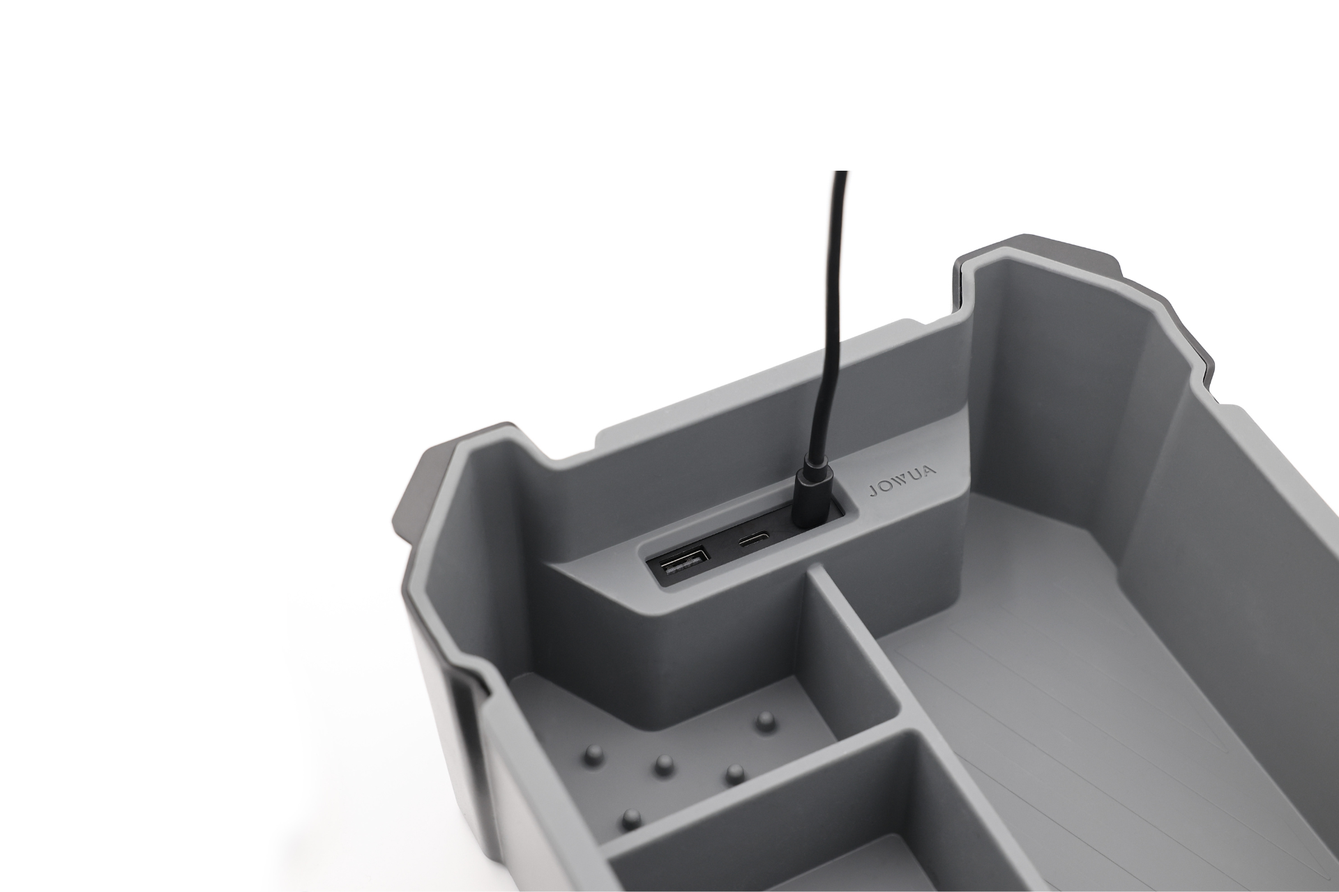A gray Center Console Set (Tesla Cybertruck) by JOWUA features compartments, two USB ports, and a charging cable plugged in, resembling a Tesla Cybertruck organizer, with the JOWUA brand name shown against a clean white background.
