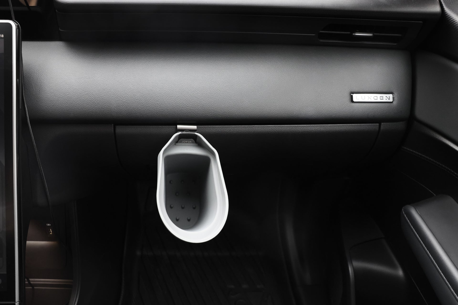 The JOWUA Door Side Storage Box (Set of 2) is attached to the glove compartment in the front passenger area of a car with a black interior.