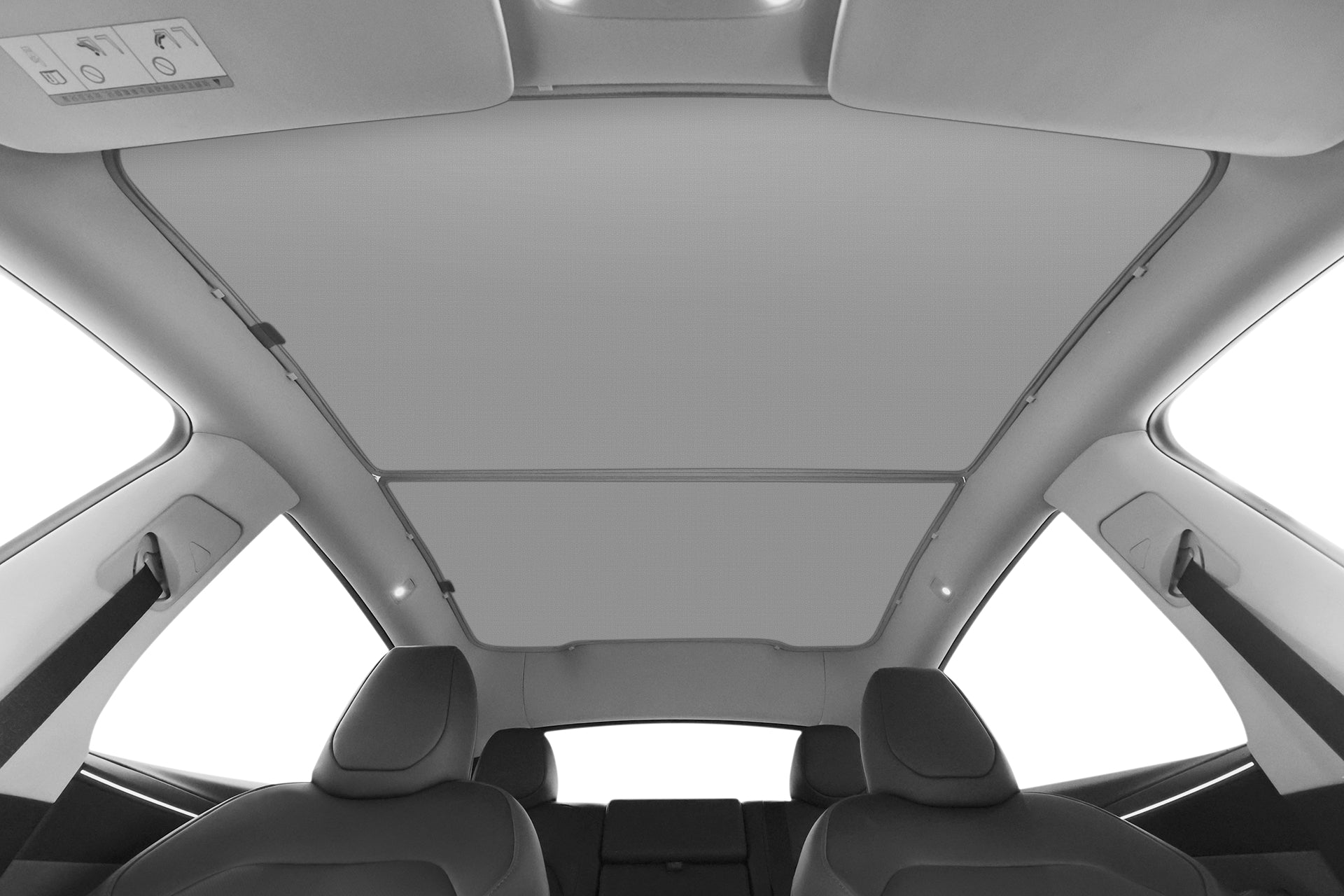 View from the backseat shows the JOWUA Model Y (Juniper 2025+) Glass Roof Sunshade, offering UV protection, along with two front seats, part of the rear seats, and interior ceiling lights.