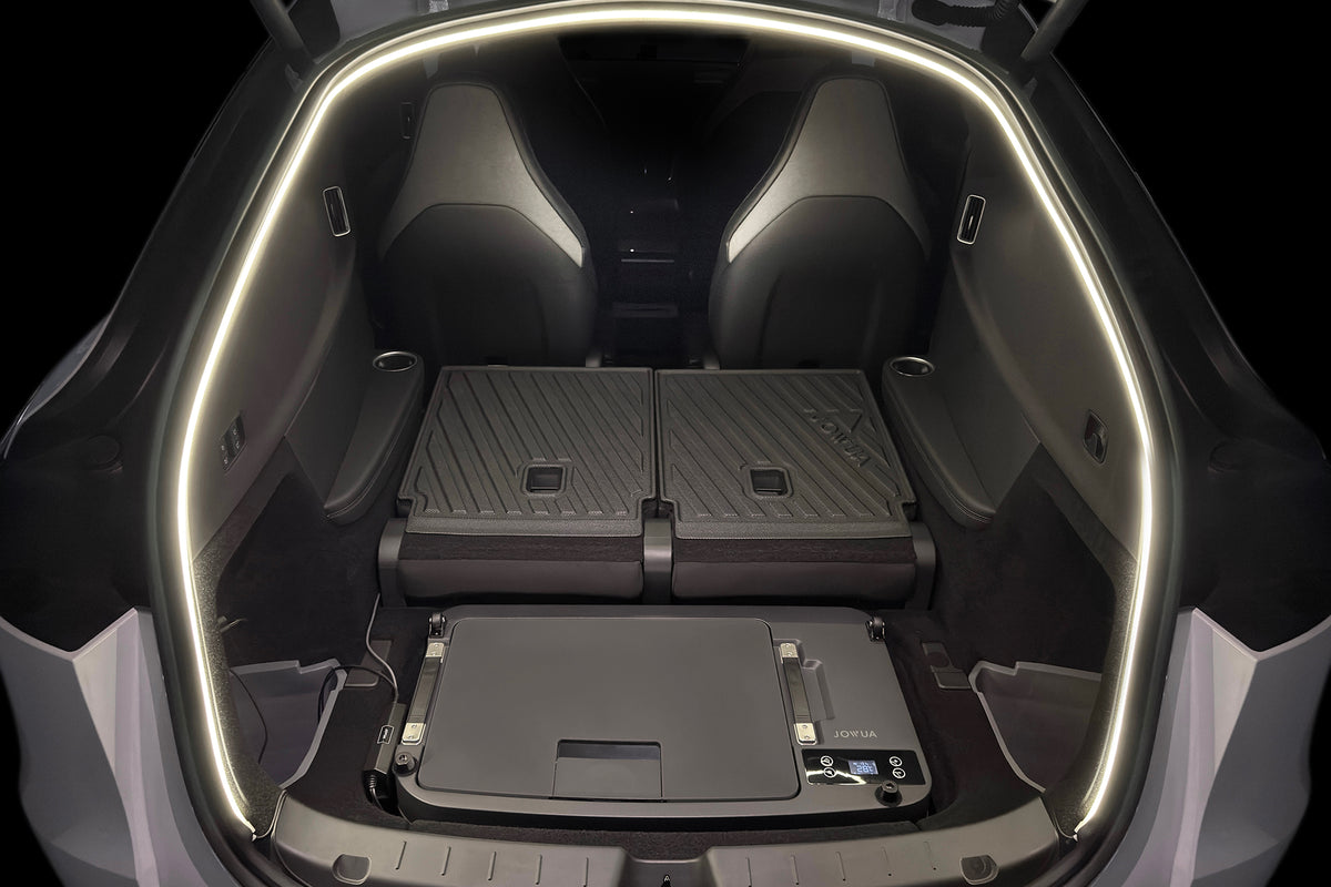 A JOWUA Car Refrigerator for Tesla Model Y L (2026+) with intelligent dual-mode cooling installed in the trunk of an electric SUV, positioned behind the folded rear seats.