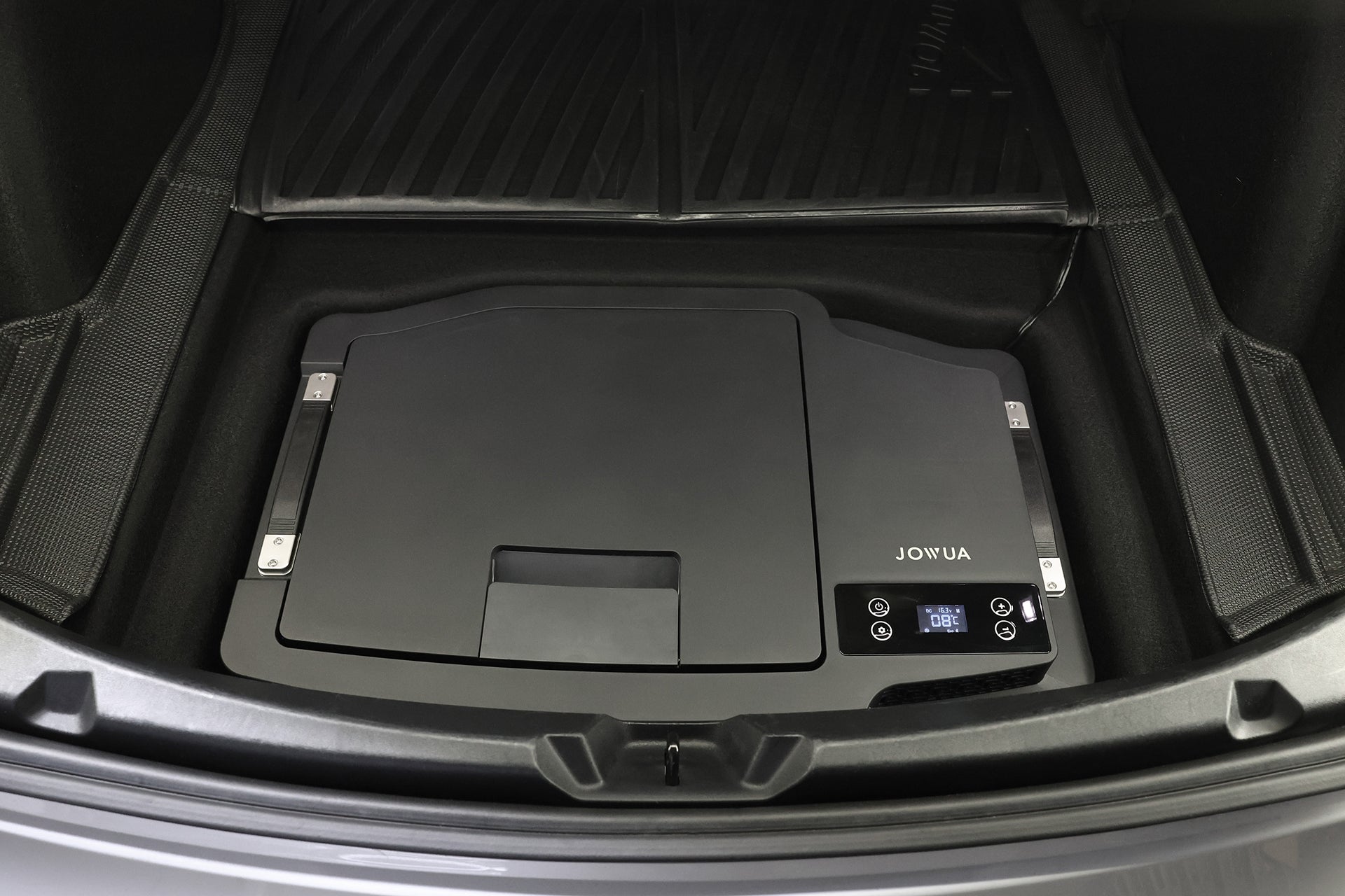 A JOWUA Car Refrigerator for Tesla Model 3 (Premium/Performance 2024-2026+) with a digital display, USB-C power, and control buttons sits on a rubber mat in the car trunk, displaying the brand name.