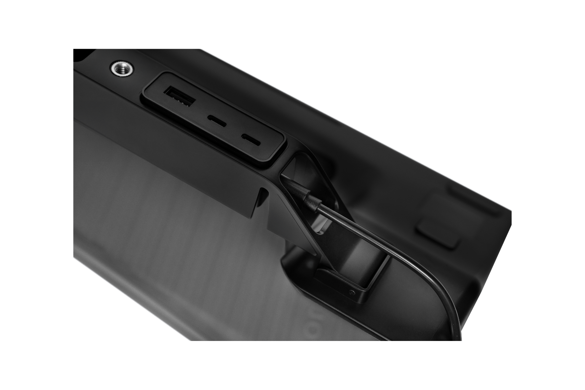 Close-up of the JOWUA Tesla Charging Essentials Set—an Apple accessory kit for Tesla Model 3 Highland (2024+) and Model Y Juniper (2025+)—showing a USB port, power button, and hinge mechanism.