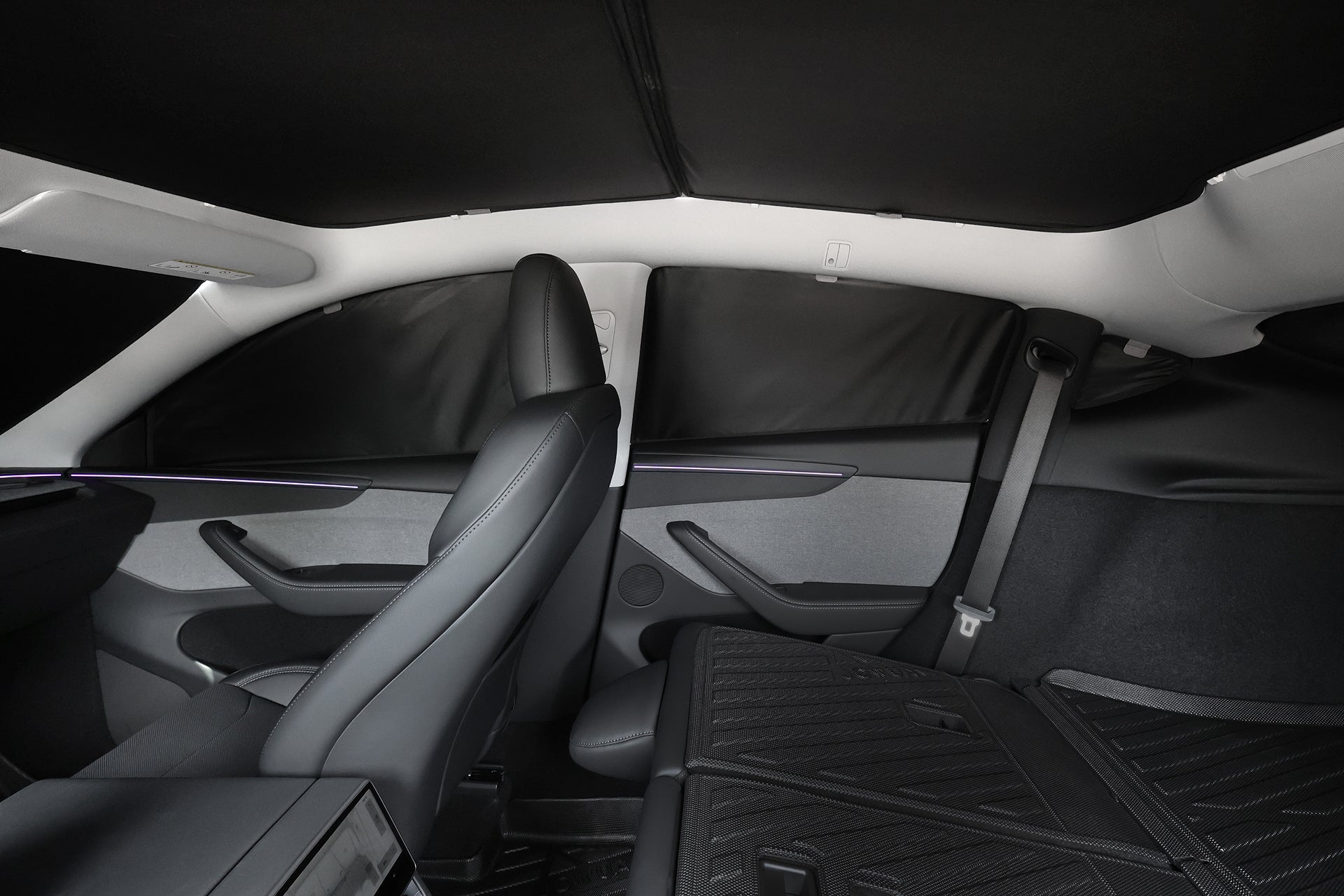 The JOWUA Side + Rear Liftgate Window Sunshade for Model Y Juniper (2025+) custom-fits the windows and roof, blocking sunlight and creating a shaded, private interior with the rear seat folded down.