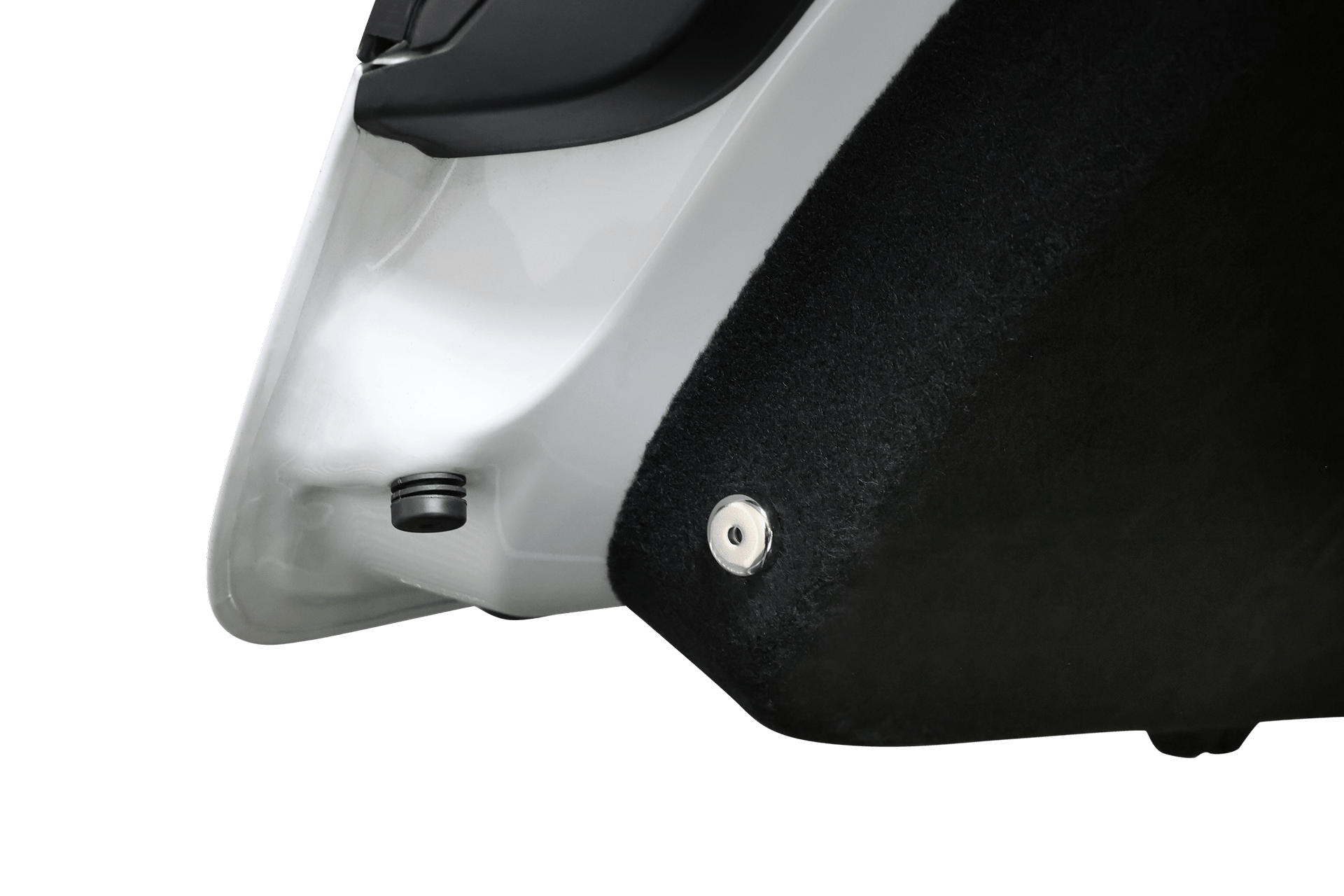 Close-up of a Tesla Model X door’s lower edge, featuring a plastic button and black carpet panel on a white exterior—highlighting details near the JOWUA Tesla Model X Trunk Ambient Light USB-C LED Strip.