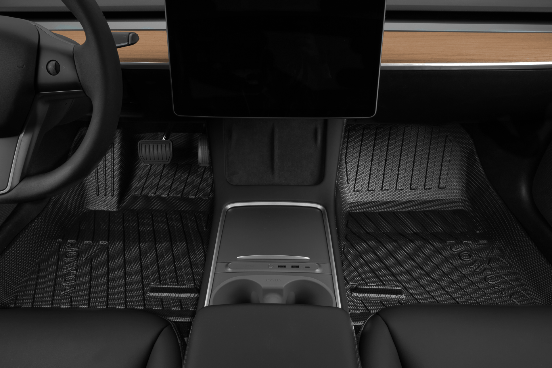 View of a Tesla Model 3 interior featuring the dashboard with a wooden finish and large central touchscreen, complemented by cup holders. The sleek, modern design is enhanced by JOWUA's custom-fit Model 3 All-Weather Floor Liners equipped with textured rubber mats, emphasizing a minimalist aesthetic.