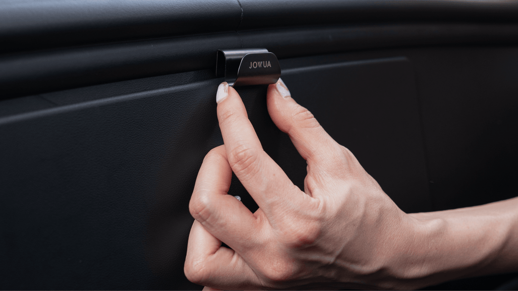 A person with manicured nails is adjusting a 
