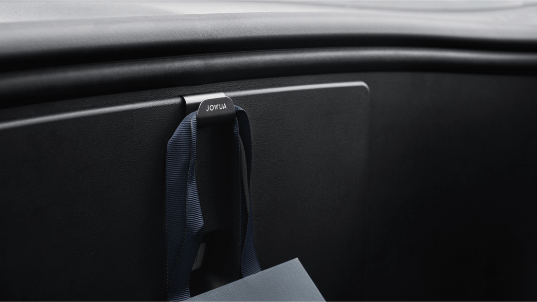The car dashboard includes a hook labeled 