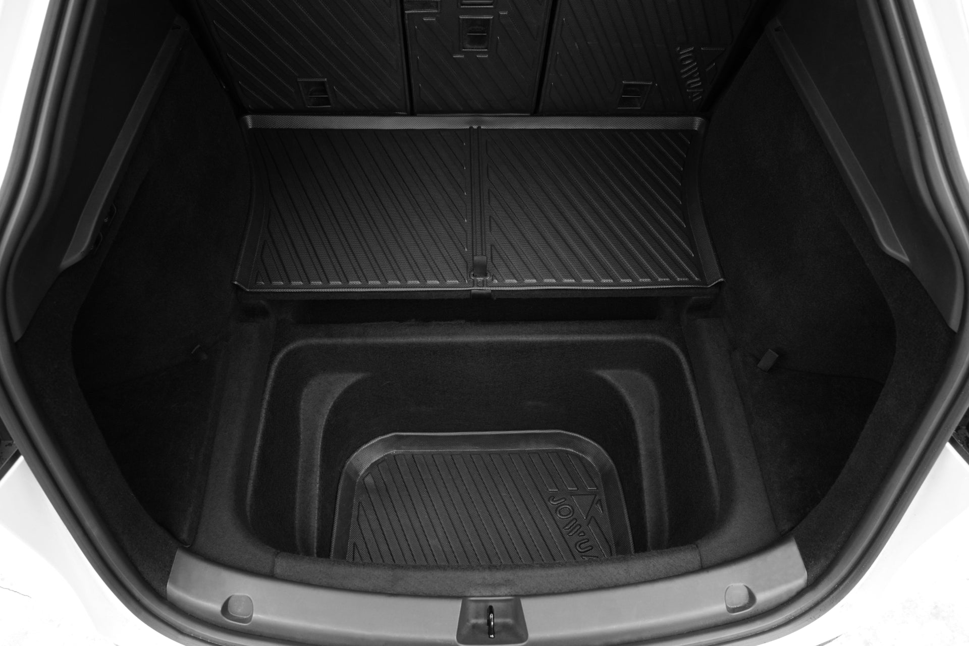 Overhead view of a JOWUA Model Y EasyShield Waterproof Trunk Liner + Rear Seats Back Cover Bundle (Juniper 2025+/2018-2024), featuring textured rubber for protection and extra storage beneath the main cargo area.