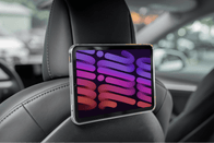 The JOWUA Taiwan Hook Bundle (Model Y) is effortlessly installed on a car headrest, featuring a vibrant screen displaying abstract shapes in purple and pink tones. The car
