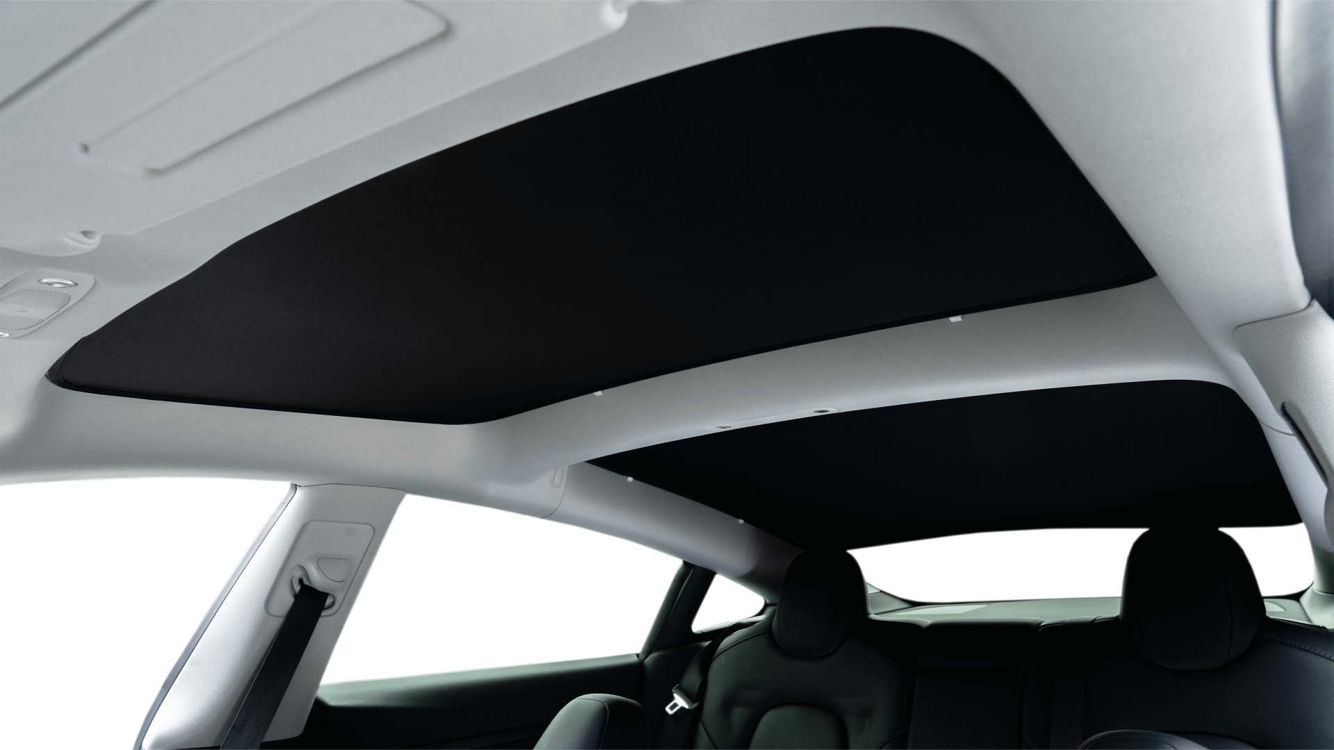 An interior shot of a Model 3 features the JOWUA Reengineered Model 3 Glass Roof Sunshade (US Version) partially deployed, emphasizing the vehicle’s spaciousness and modern design. The image highlights how UV protection seamlessly blends with style and comfort in the seating area.