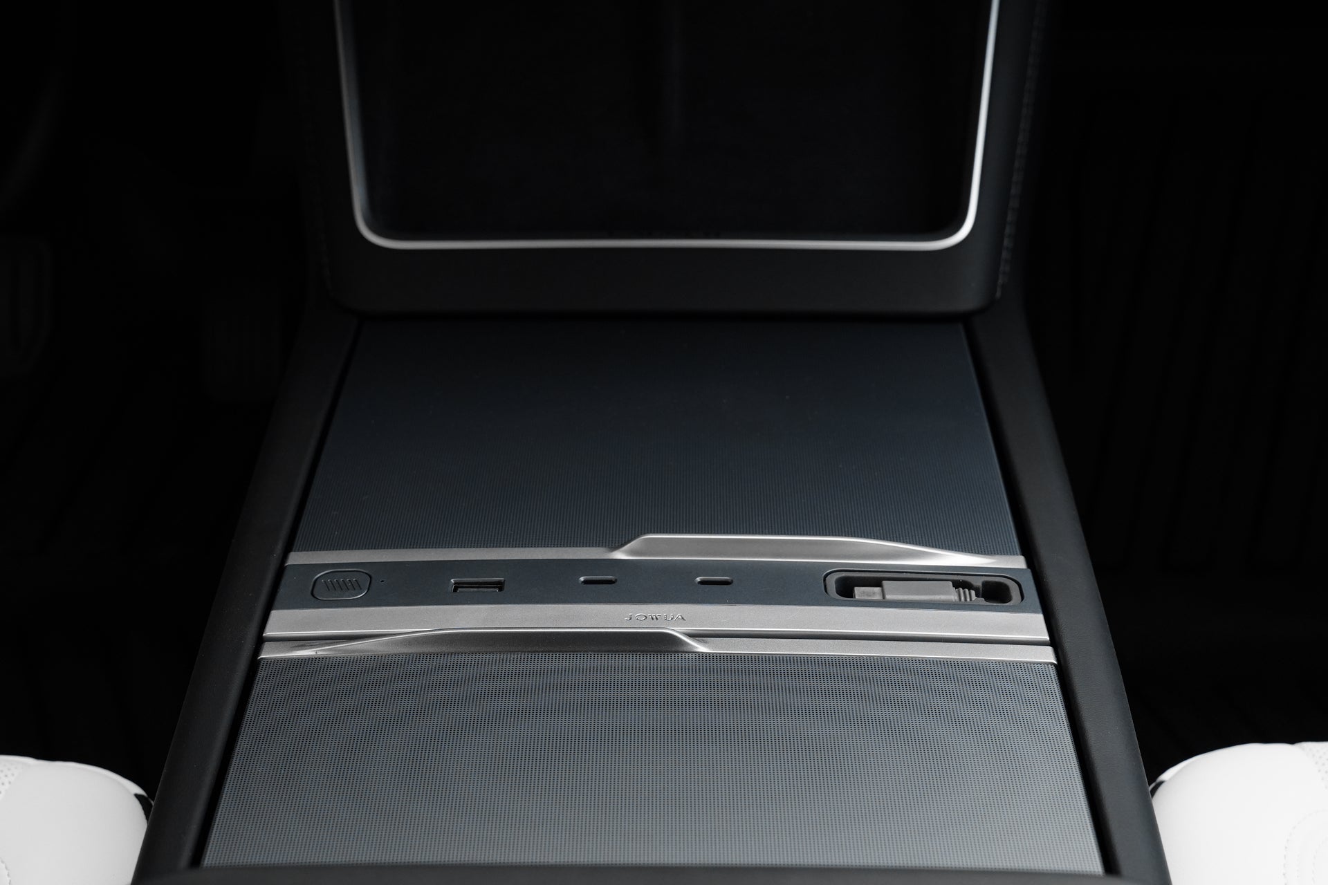 Close-up of the JOWUA 130W LED Hub for Tesla Model Y Juniper 2025+ / Model 3 2024+, showcasing a sleek, minimalist center console design with touchpad, cupholder cover, dynamic power controls, and a glossy black-silver finish.
