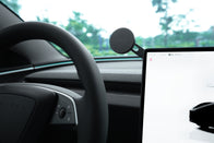Close-up of a JOWUA 6D Tesla Compatible Invisible Foldaway Car Mount Qi2 Wireless Charger (MagSafe), sleekly mounted beside the dashboard display—an ideal upgrade for your S/3/X/Y/Cybertruck wireless charging setup.
