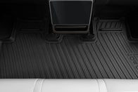 JOWUA’s All Model Y All-Weather Floor Liners Combo (Juniper 2025+ / 2021-2024) offers rear footwell protection, seen here under a touchscreen display and white seat—ideal for Tesla Model Y accessories fans.