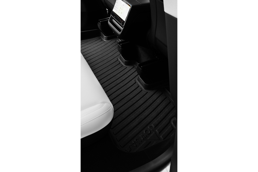 JOWUA All Model Y All-Weather Floor Liners Combo (Juniper 2025+ / 2021-2024) in sleek black is installed in the rear seat area of a Tesla Model Y with white leather seats and a digital center console visible.