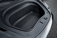 Close-up of an empty JOWUA Model 3 All Weather Trunk Combo (Reengineered Model 3 Highland, 2024+) with a rubber mat, highlighting its sleek and minimalistic design. The open trunk reveals a smooth, dark interior crafted from waterproof TPE material. The car is parked on a paved surface.
