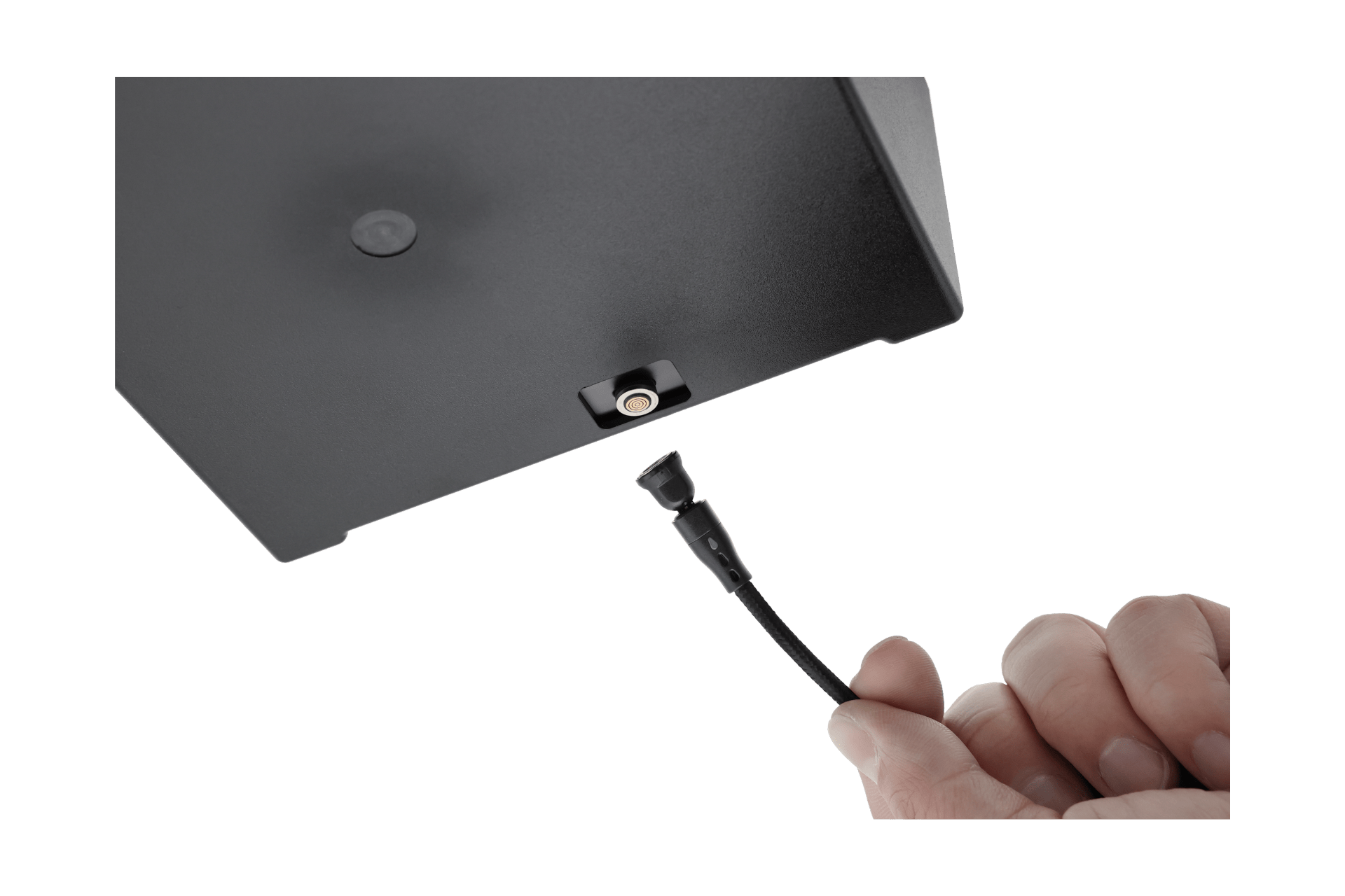 A hand holds a black braided cable with a connector, about to plug it into the Center Console Organizer Set with Power HUB (Tesla Model 3 Standard 2026+) by JOWUA, next to a silicone armrest mat.