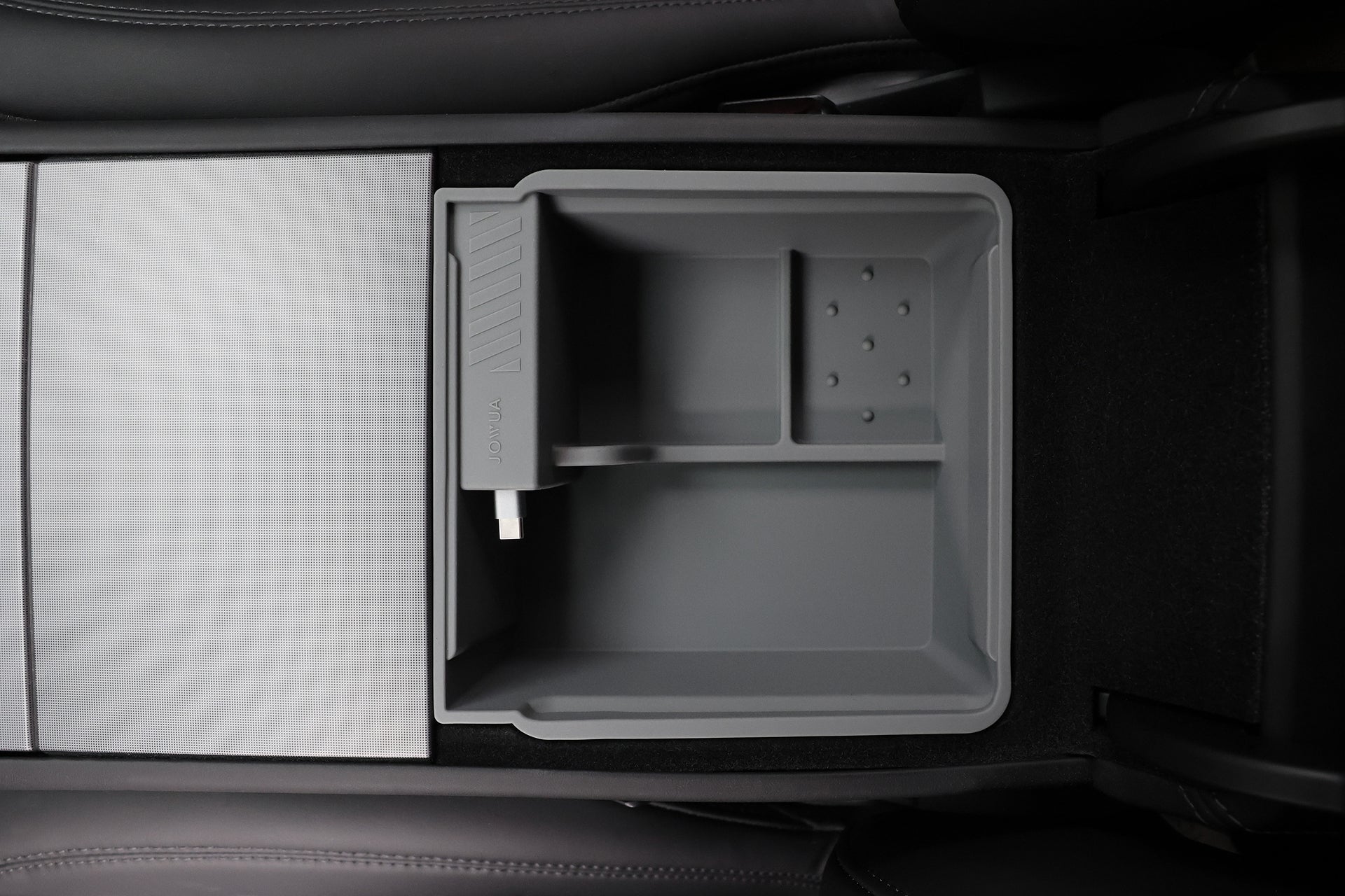 The JOWUA Center Console Organizer Set with Power HUB, designed for Tesla Model 3 (2024-2026+), fits in the central console between two black leather seats and features divided compartments and a silicone mat.