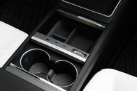 Close-up of the JOWUA 130W LED Hub for Tesla Model Y Juniper 2025+ / Model 3 2024+, shown in the center console with cup holders, storage compartment, and USB ports—a sleek charging solution for modern drivers.