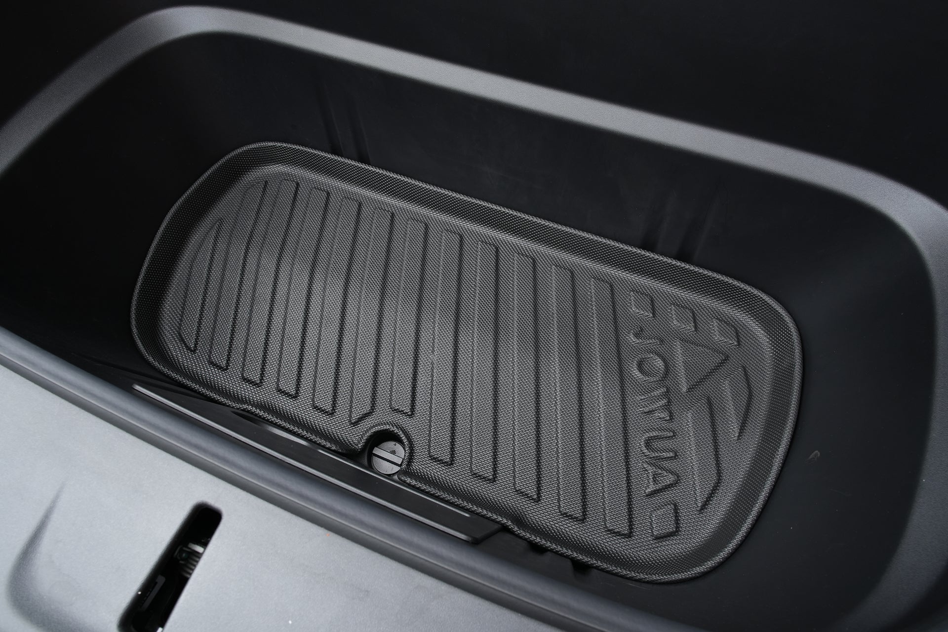 Close-up of the JOWUA Model Y L (2026+) Interior / Trunk Full Coverage Liner Combo, a black rubber waterproof liner with raised lines and embossed 