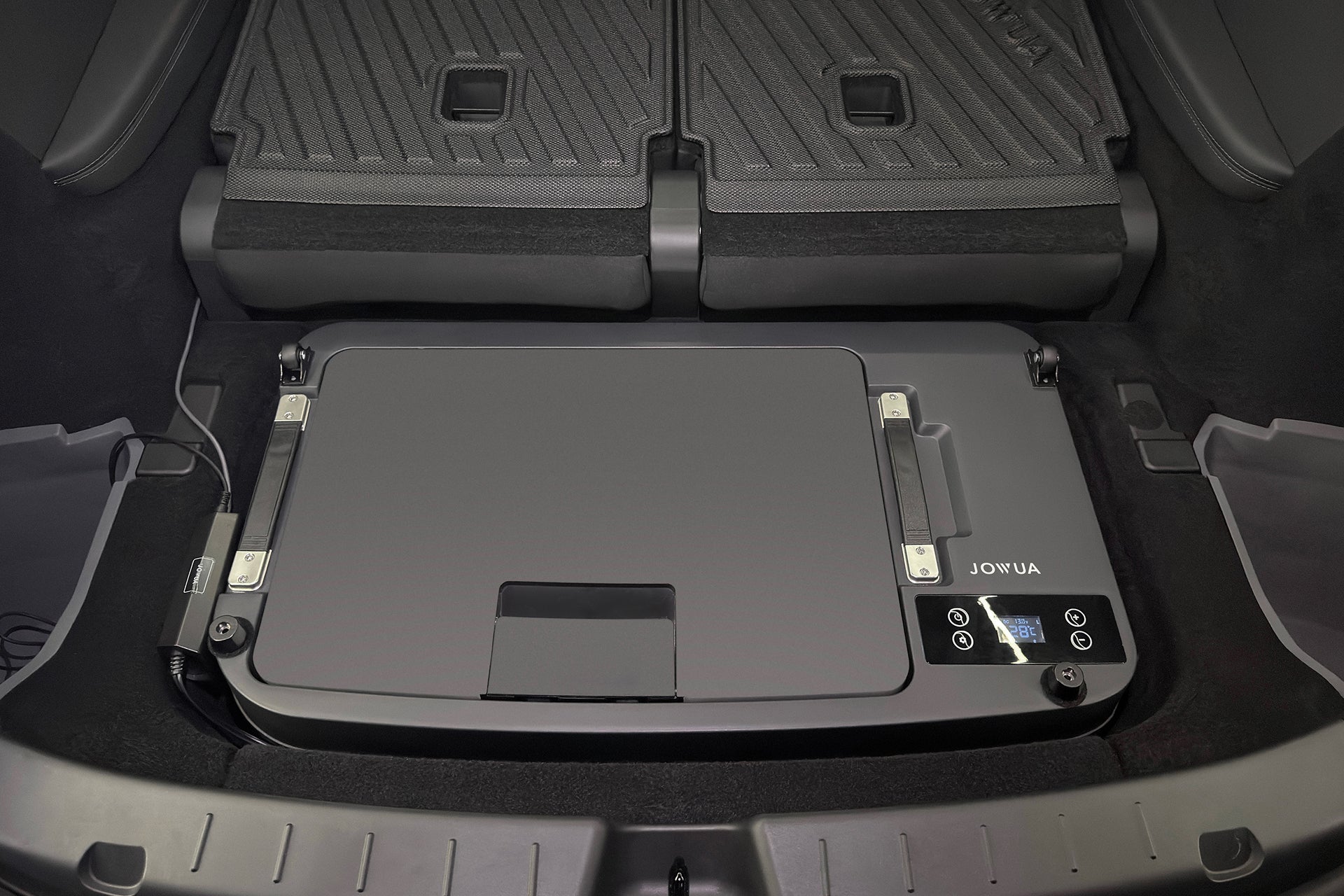 A JOWUA Car Refrigerator for Tesla Model Y L (2026+) installed in a vehicle trunk, featuring a digital temperature display, intelligent dual-mode cooling, and controls on the top panel.