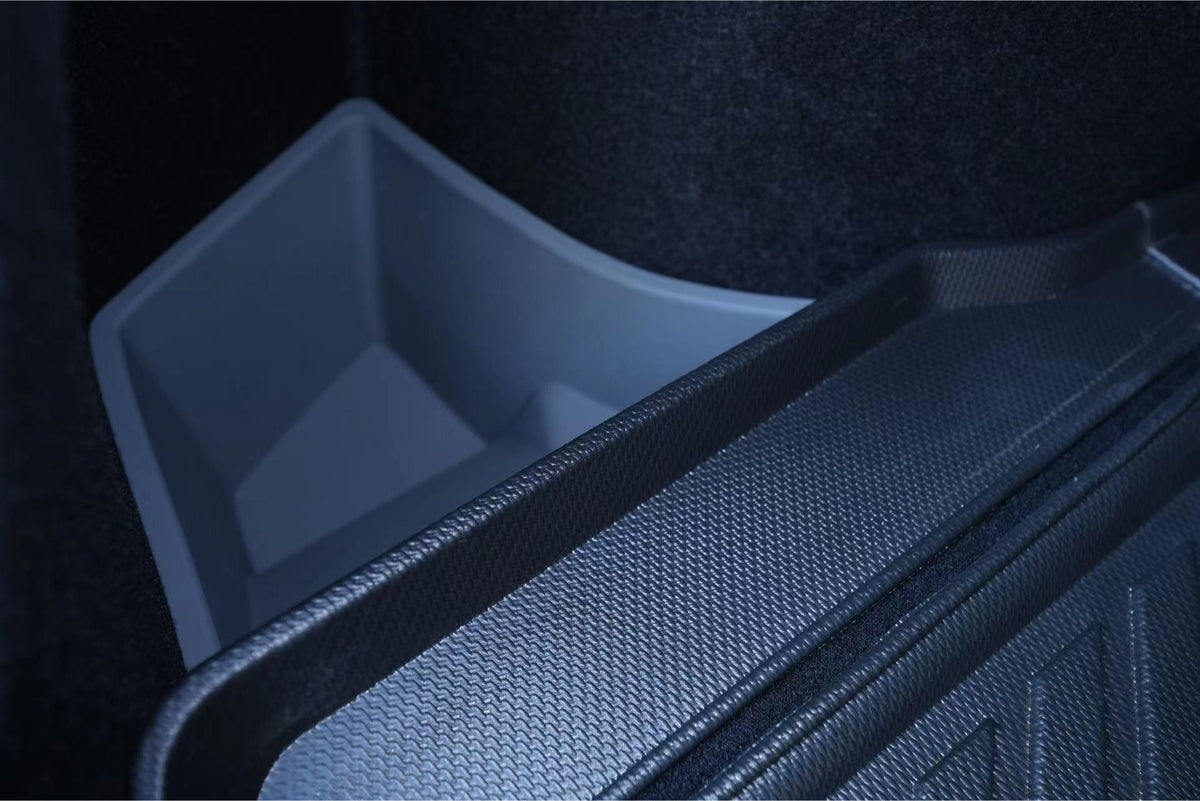 Close-up of JOWUA Trunk Storage Bins for Tesla Model 3 Highland (2024+), featuring a textured black mat and silicone bin, set against a dark interior—ideal for organized trunk storage.