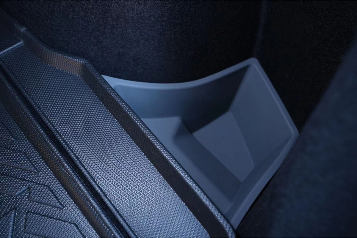 Close-up of JOWUA Trunk Storage Bins for Tesla Model 3 Highland (2024+) in textured black, with a gray silicone organizer positioned in the trunk’s recessed area.