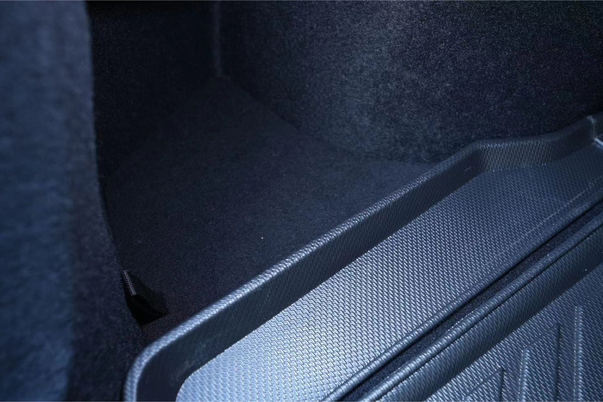 Close-up of a car trunk interior with textured dark fabric lining and JOWUA Trunk Storage Bins for Tesla Model 3 Highland (2024+) featuring silicone bins neatly placed on the right side.