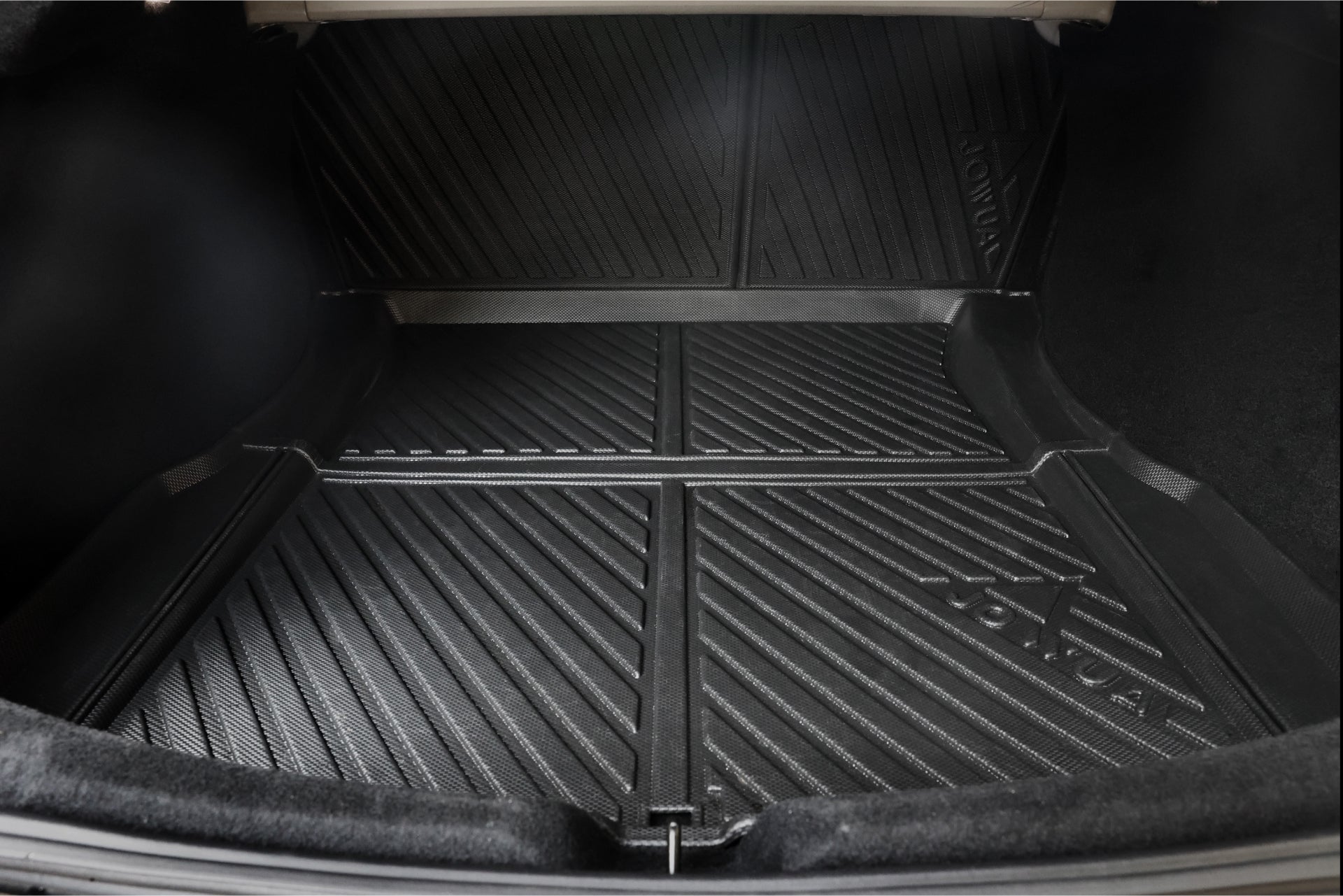 The image showcases the interior of a Tesla Model 3 lined with the durable JOWUA Model 3 All Weather Trunk Combo (Reengineered Model 3 Highland, 2024+). This waterproof mat, made from TPE material, is clean and well-fitted with grooves designed to efficiently catch debris.
