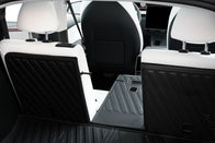The JOWUA Model Y EasyShield Trunk Liner + Rear Seats Back Cover Bundle (Juniper 2025+/2018-2024) showcases flexible storage with one upright and one folded rear seat, protecting the stylish black and white interior.