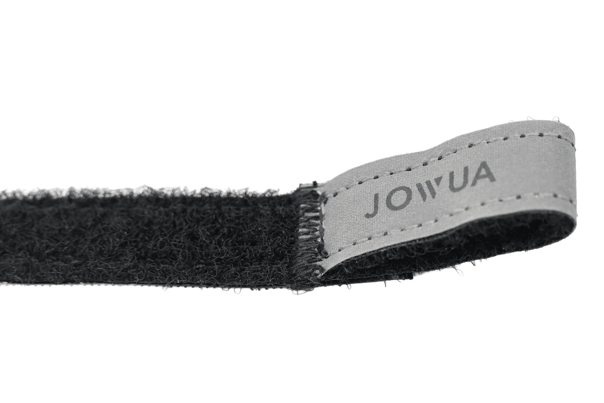 A close-up of JOWUA's Reflective Rear Door Emergency Release Strap (Model 3 Highland, 2024+ / All Model Y), featuring black fabric, a sewn-on 