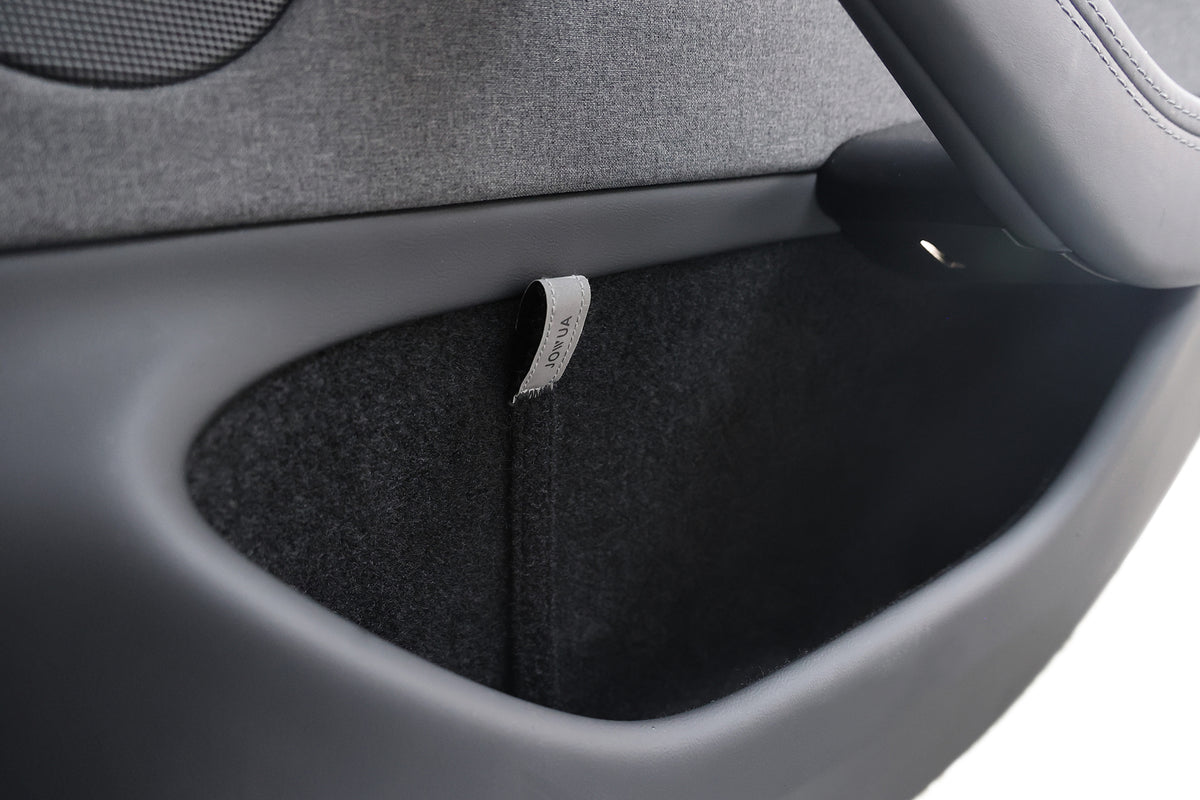 Close-up of a car door pocket with a gray 