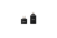 Two elegant black adapters from the JOWUA Sentry & DashCam Adapter Set OTG are showcased on a white background. Each bears the brand name "JOWUA" in sharp white lettering, with one providing USB-C connectivity and the other equipped with a Lightning connector. Designed ideally for Tesla Sentry iPhone users, these adapters seamlessly incorporate OTG functionality.