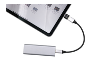 A tablet with OTG functionality is connected to a sleek, rectangular external hard drive using a USB-C cable. The screen displays several file icons, indicating data transfer. The JOWUA Sentry & DashCam Adapter Set OTG (USB-A to Type-C & Lightning) enhances connectivity for Tesla Sentry iPhone users.