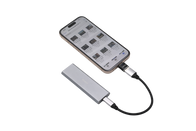 A JOWUA Sentry & DashCam Adapter Set OTG (USB-A to Type-C & Lightning) smartphone is linked to a compact, metallic external SSD using a brief cable. The device displays a file management app, showcasing various files on the screen. The USB-A to Type-C & Lightning adapters from JOWUA enhance connectivity options for seamless access and storage.