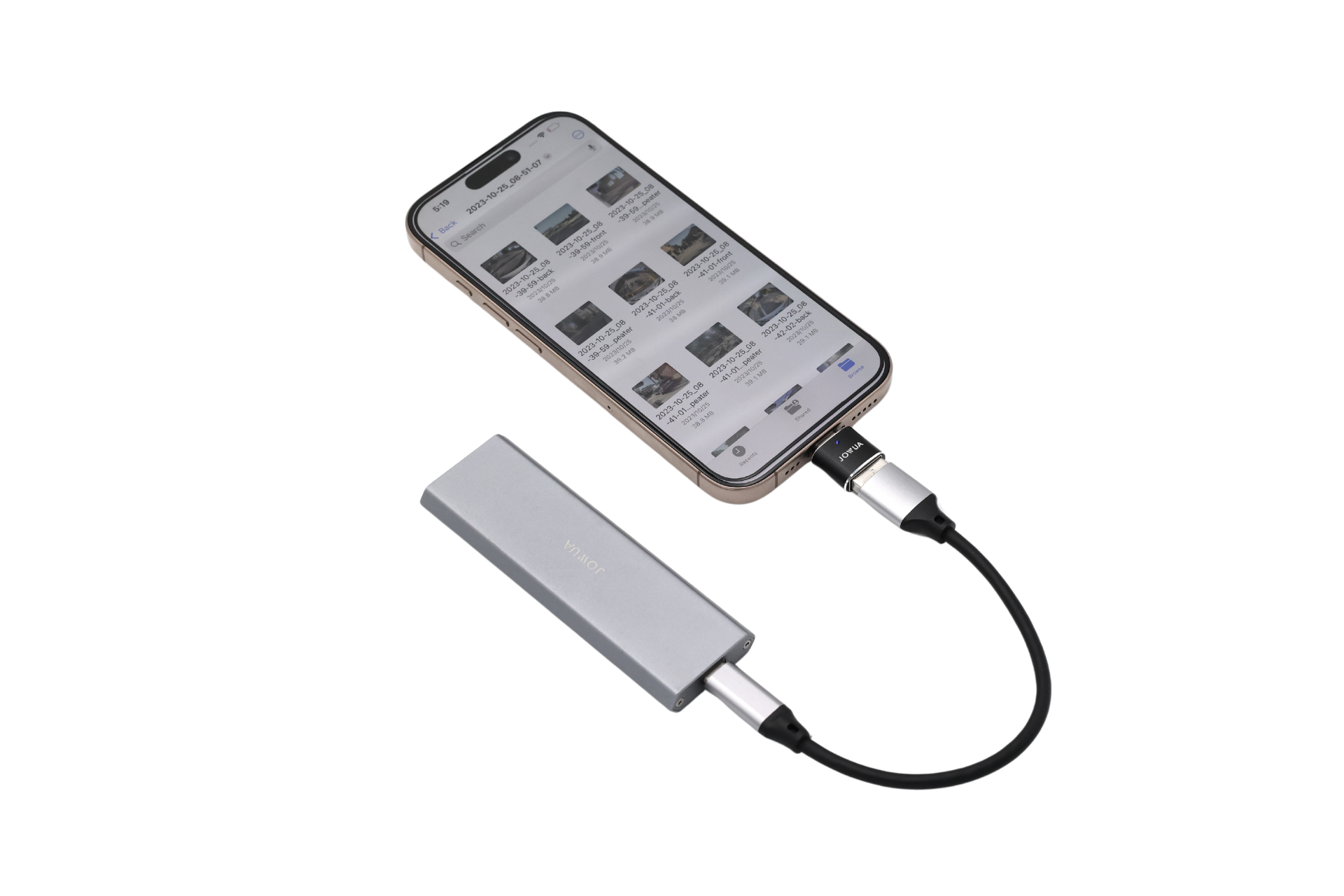 A smartphone uses the JOWUA Sentry & DashCam Adapter Set OTG (USB-A to Type-C & Lightning) in silver, connected by a black cable, with file thumbnails on screen to show data transfer between devices.