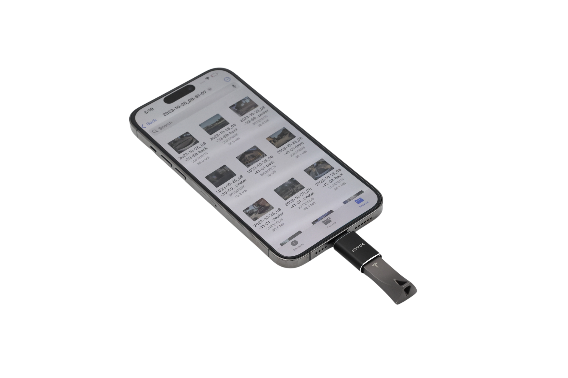A smartphone shows a photo gallery with a black JOWUA Sentry & DashCam Adapter Set OTG (USB-A to Type-C & Lightning) connected to its charging port on a plain white background.