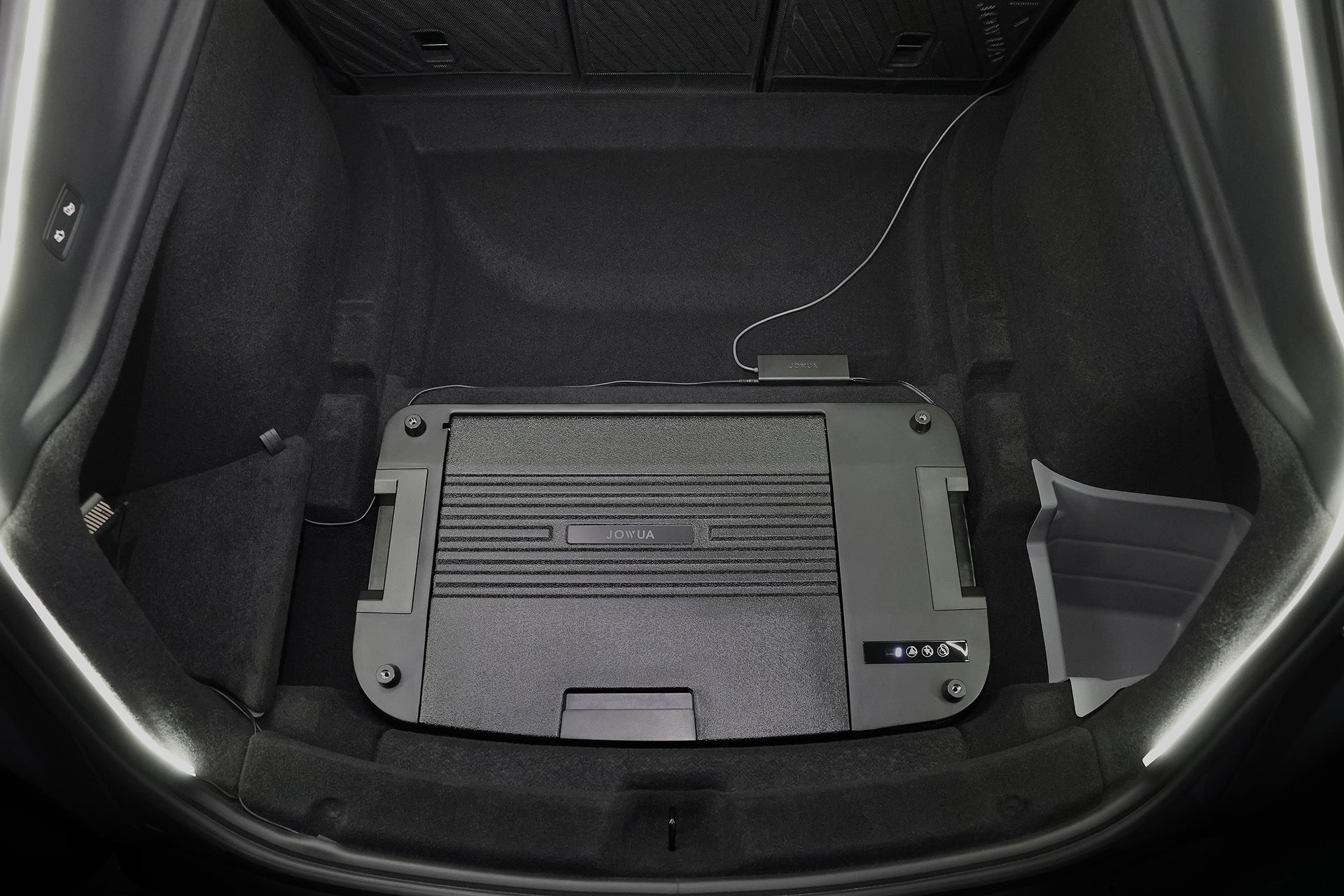 A close-up of a Tesla Model Y trunk shows the JOWUA Car Refrigerator with a prominent display panel, intelligent dual-mode cooling, and a charging cable connected on the right side.